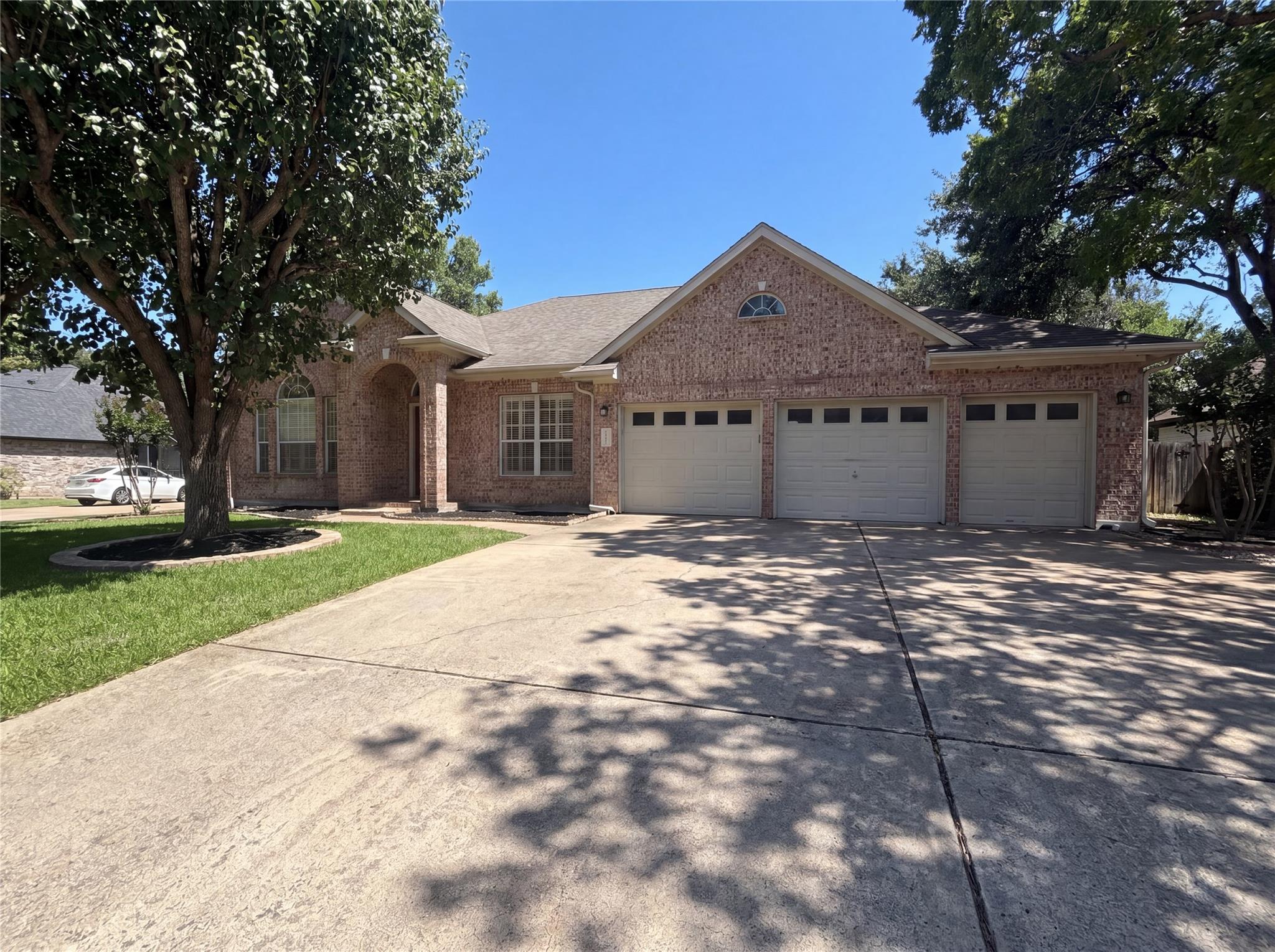 A classic brick exterior offers generous parking 