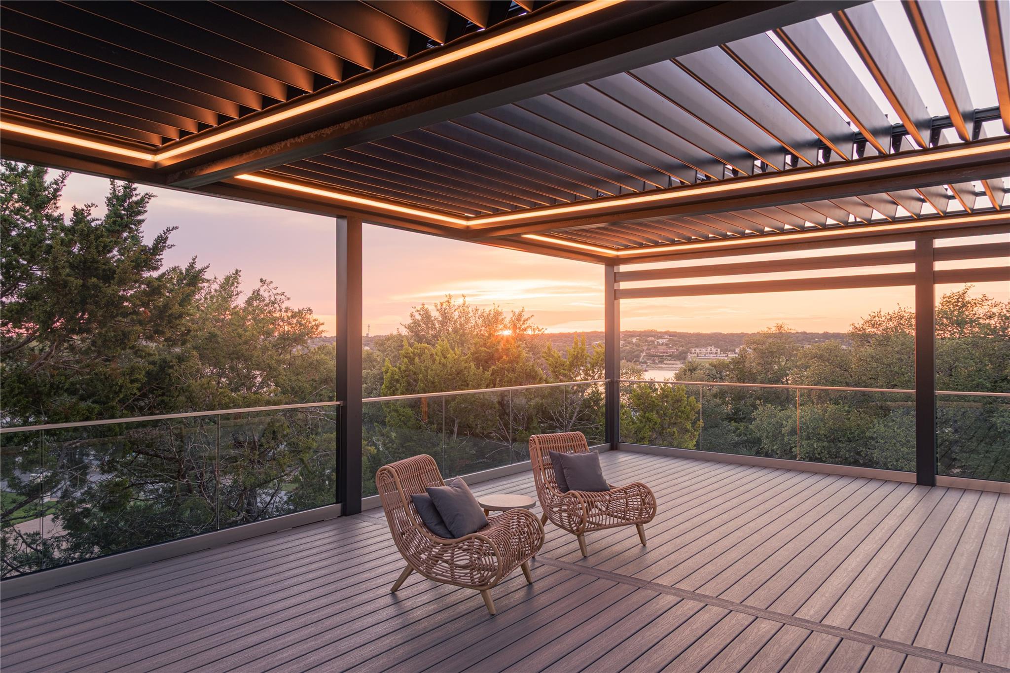 An inviting deck offers panoramic views of the wa