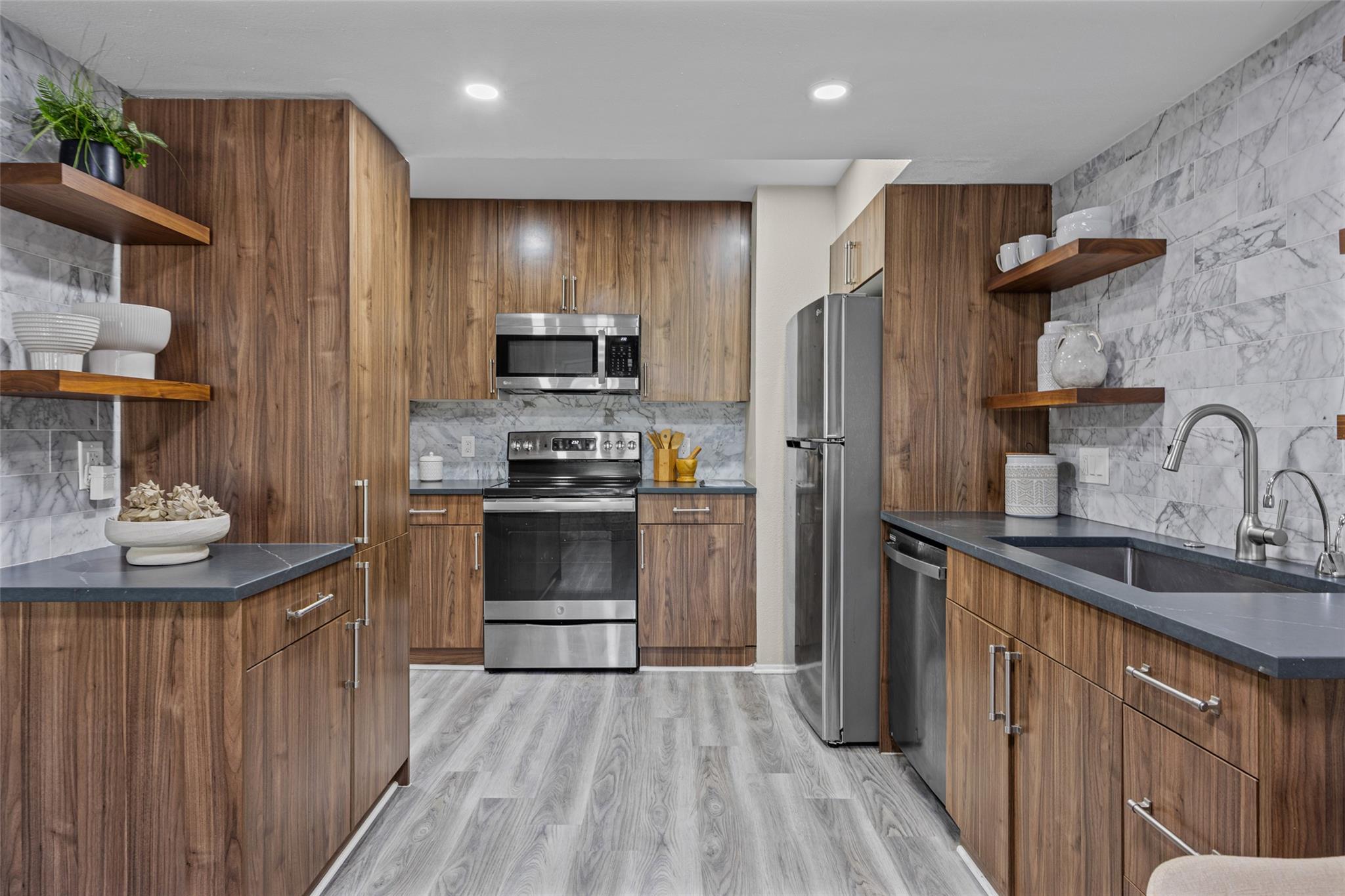 Rich wood cabinetry contrasts beautifully with st
