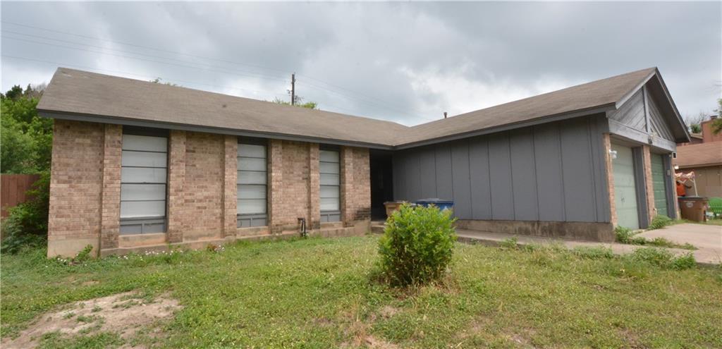 A well-proportioned brick and siding home awaits,