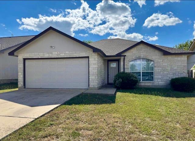 A classic brick exterior and attached garage crea