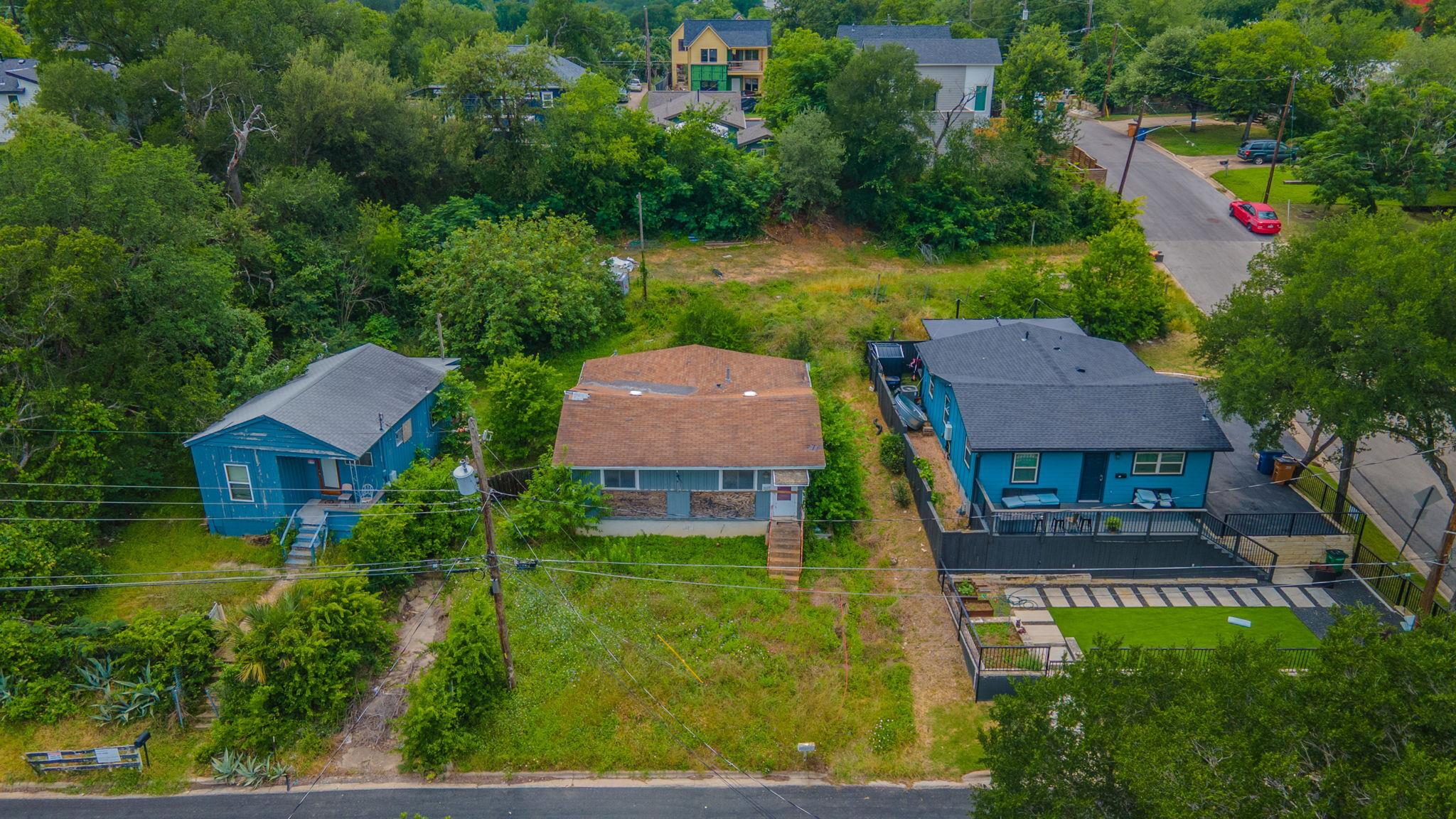 Three properties nestled in a green, tree-filled 