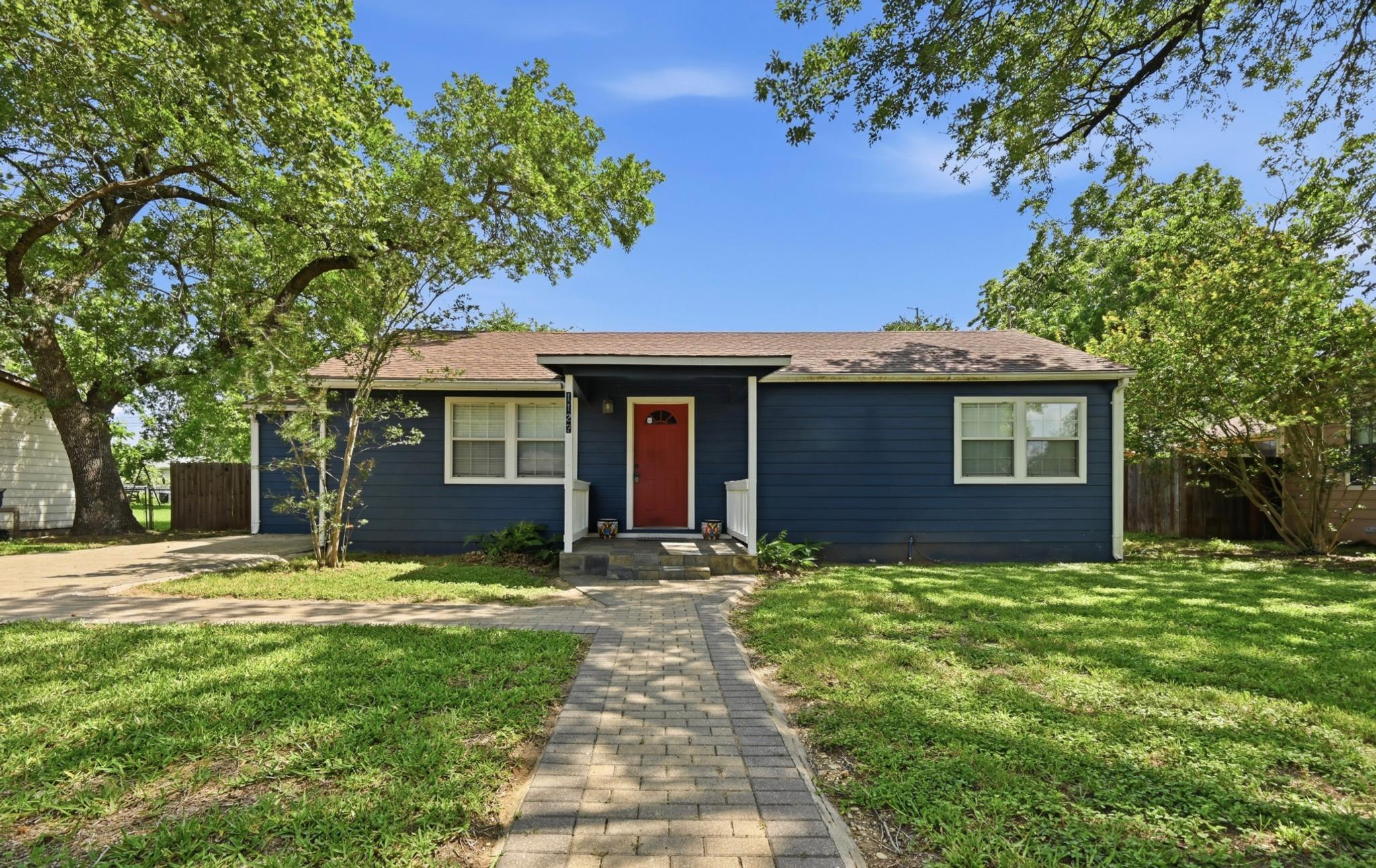 A welcoming path leads to this charming residence