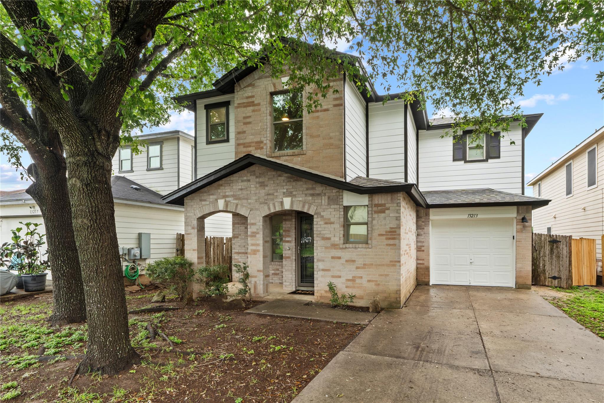 A charming two-story residence blends brick and s