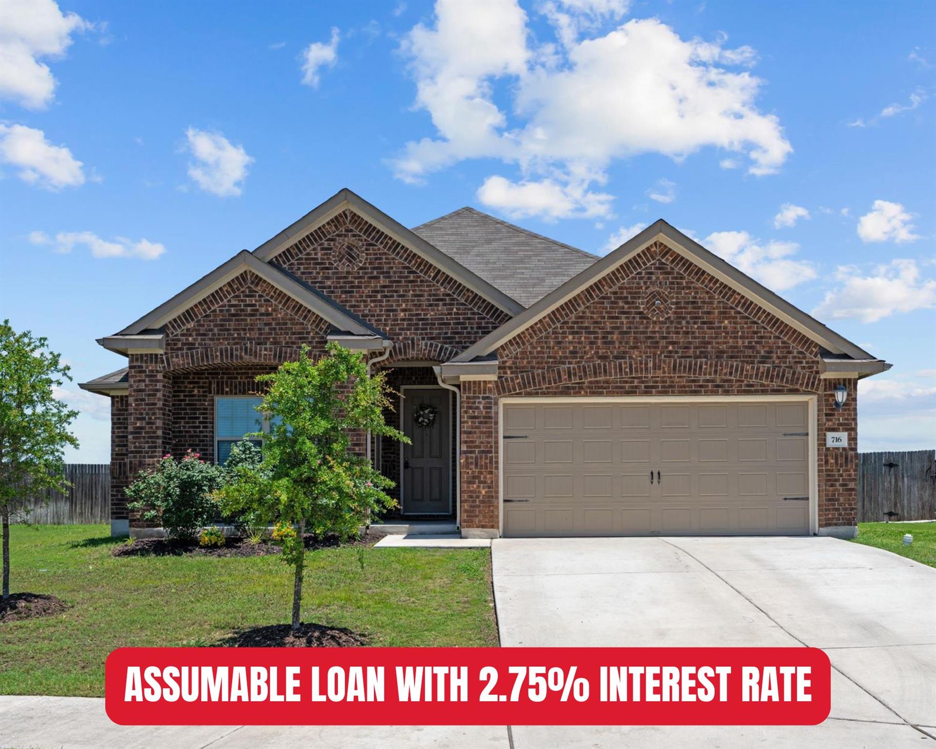 A classic brick facade with an attached garage we