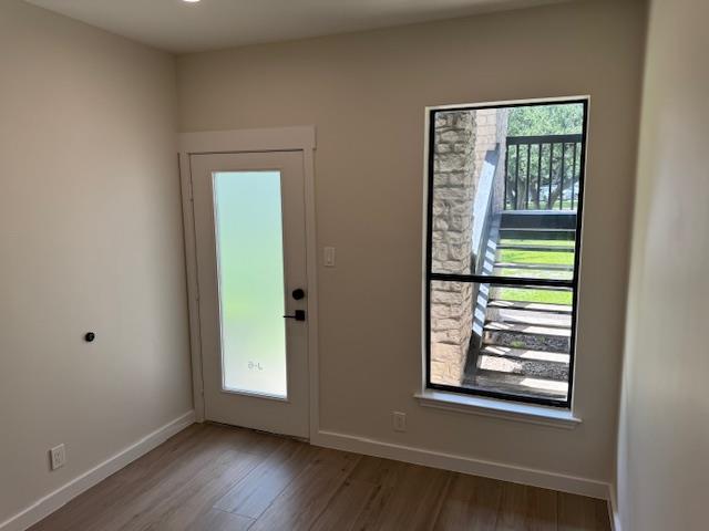 Laminate flooring and high ceilings elevate this 