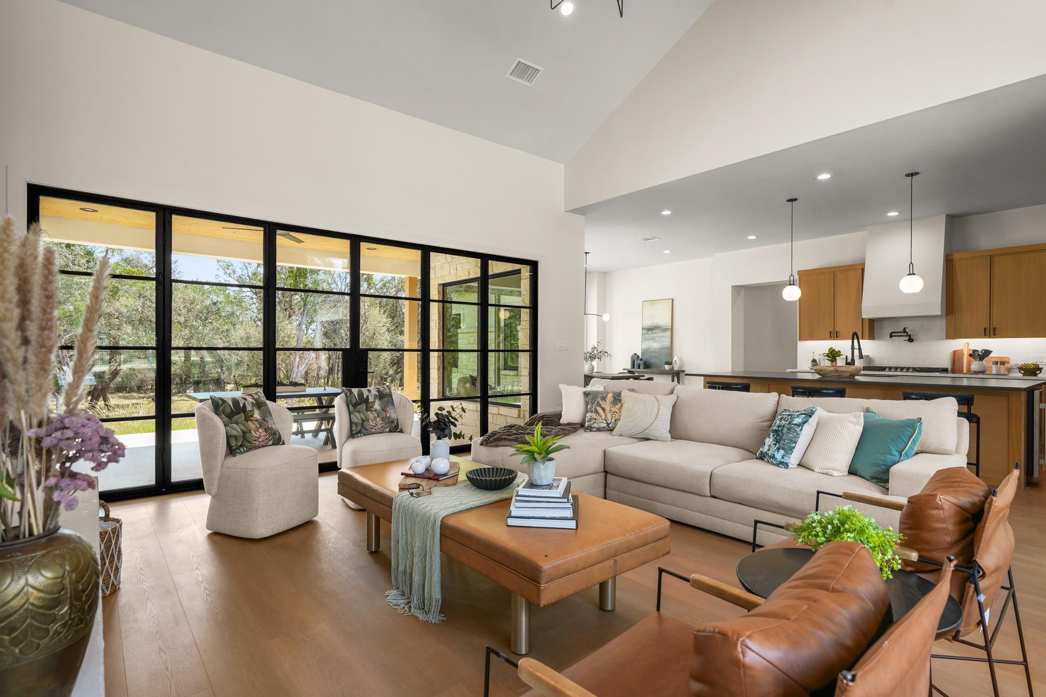 High ceilings and a wall of glass doors define th