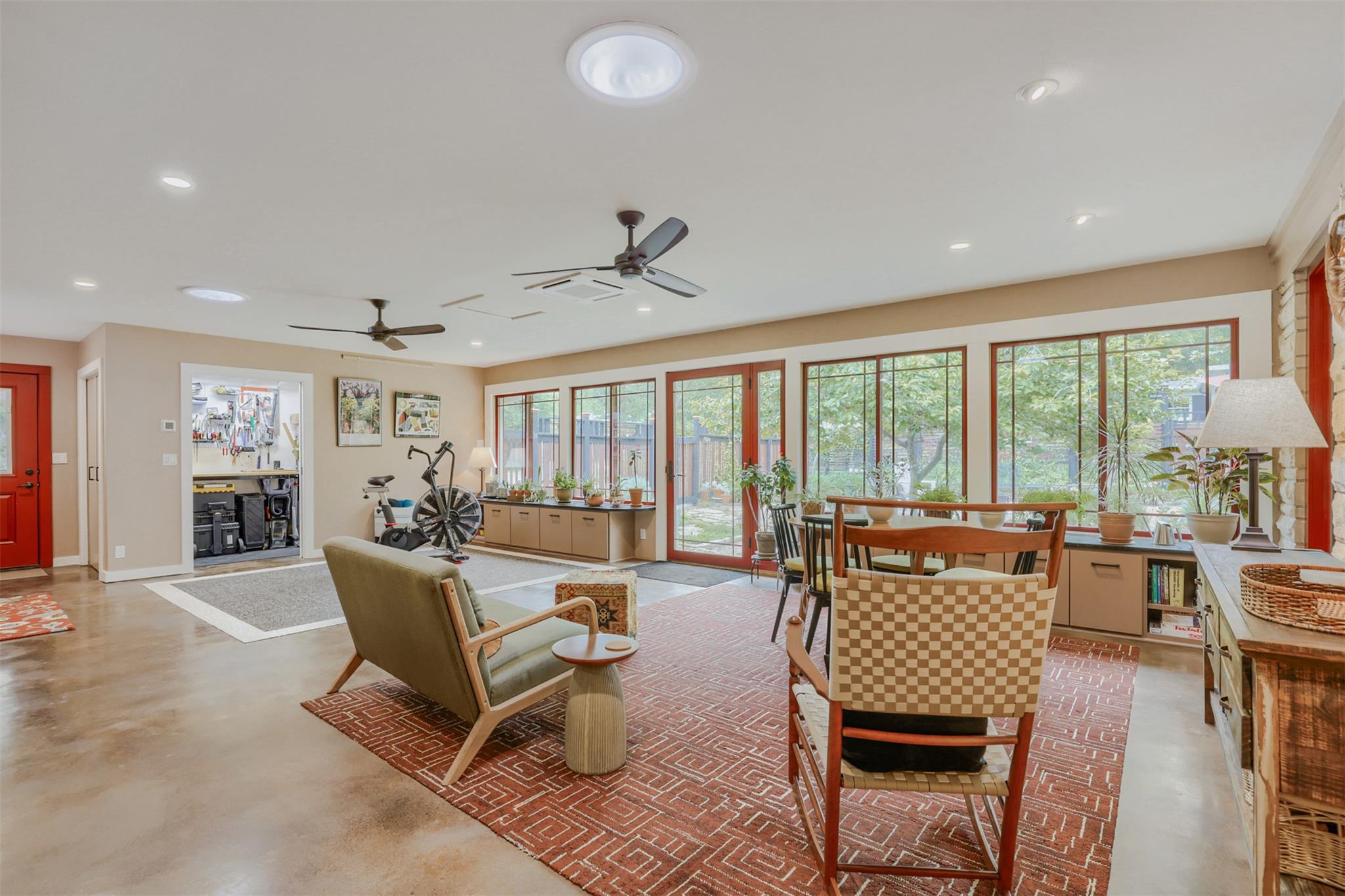 Natural light floods this adaptable living space 