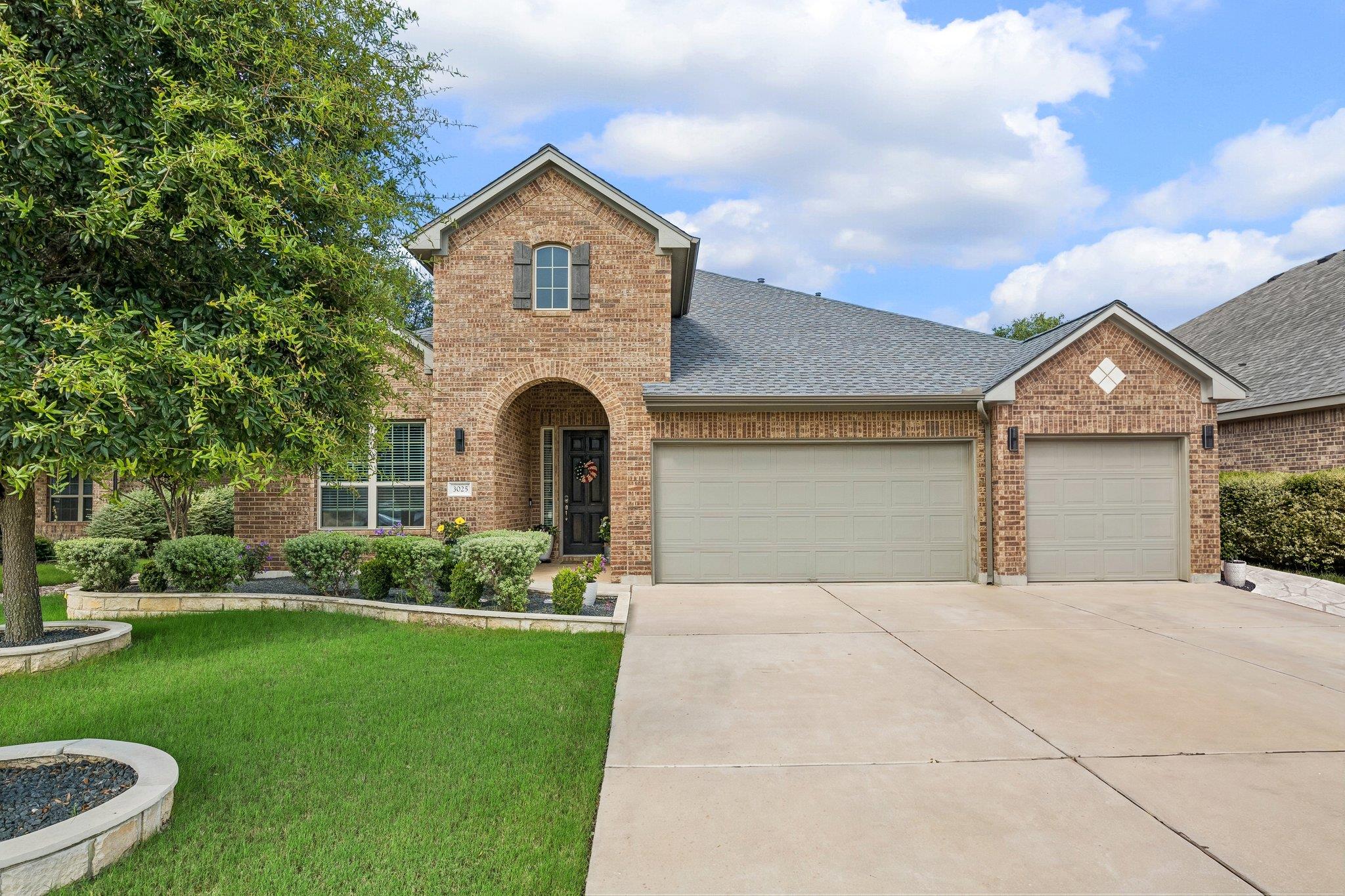 A classic brick exterior with well-maintained lan