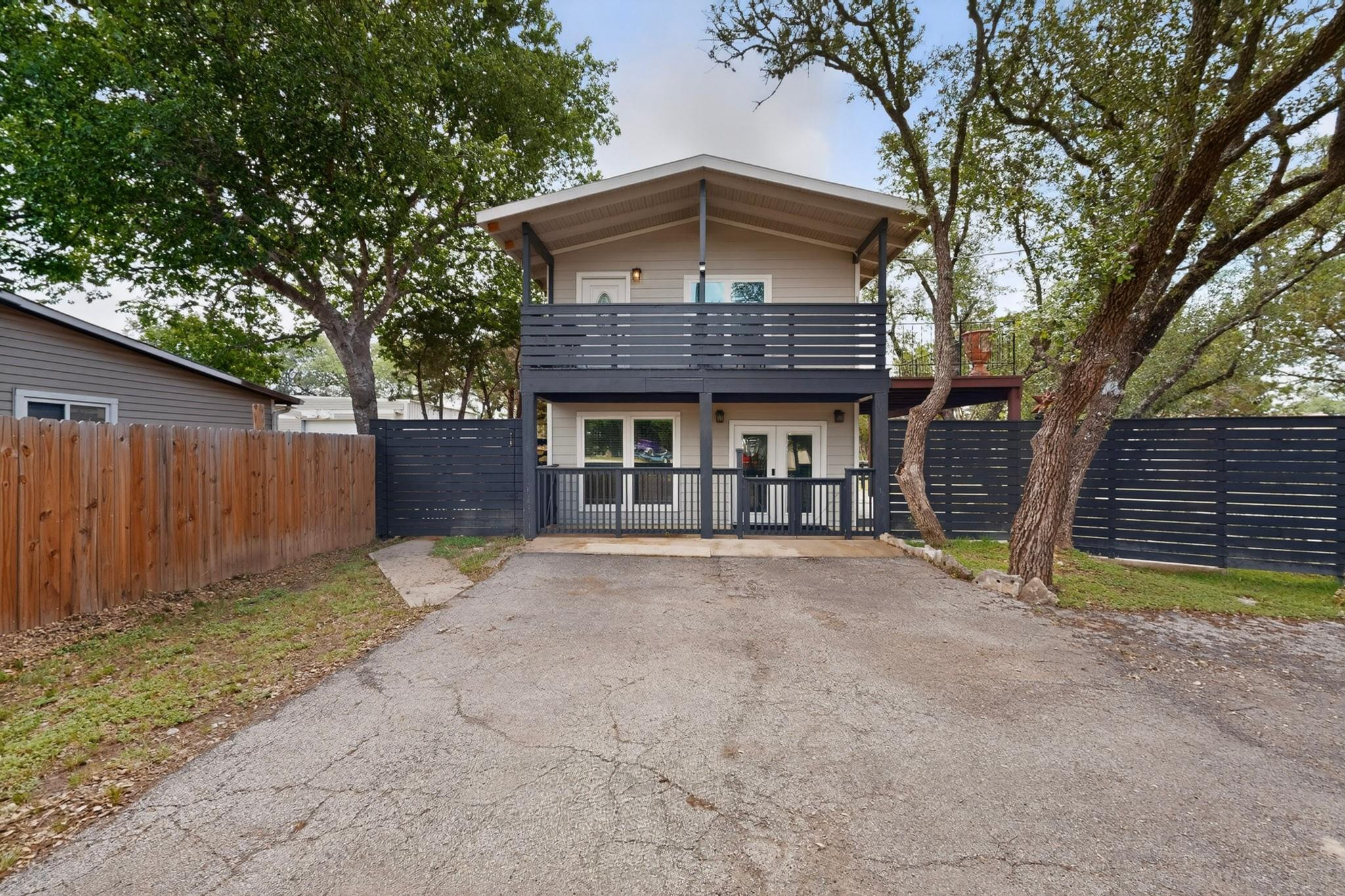 A charming modern home with dual balconies offers