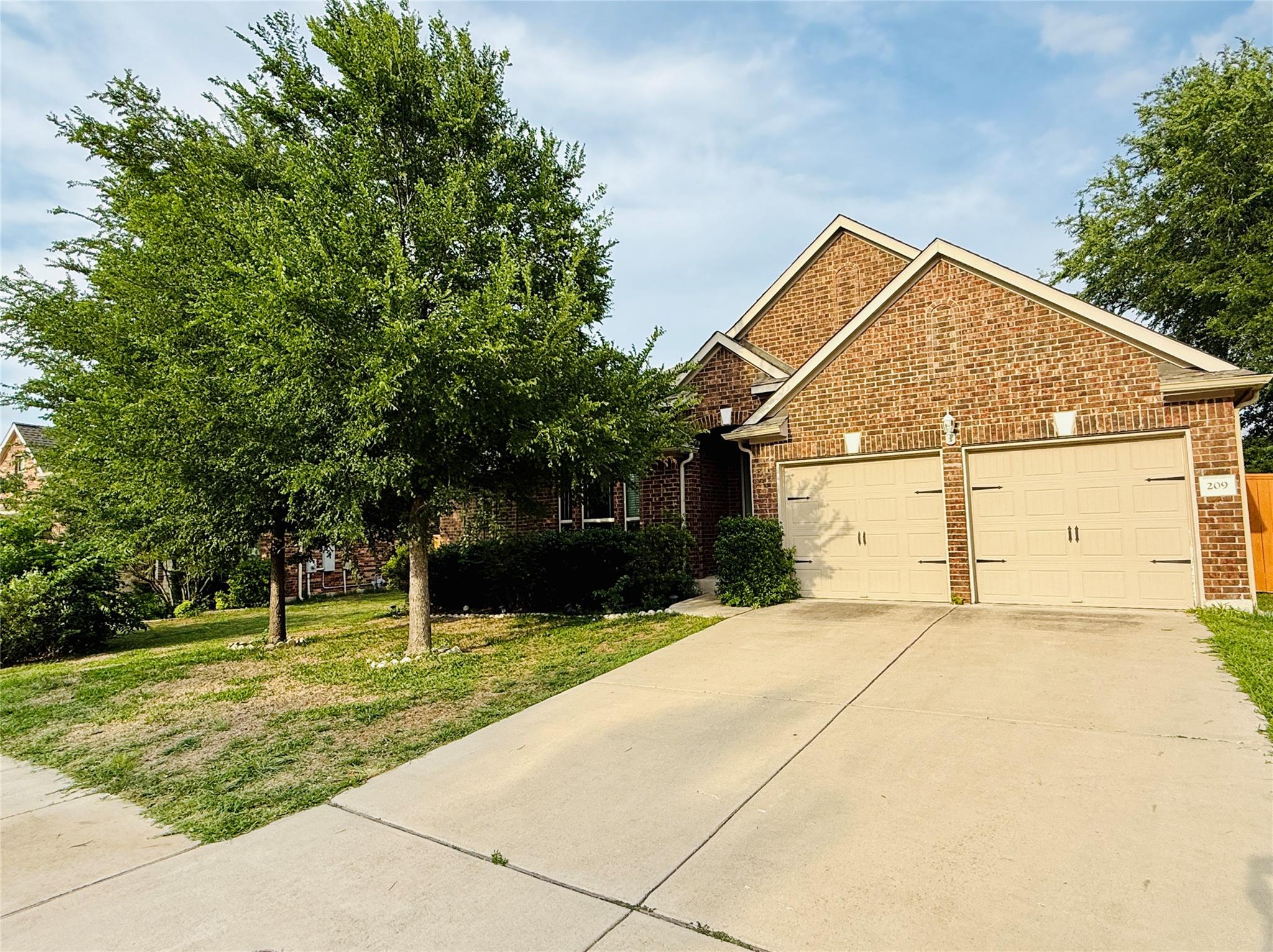 A classic brick exterior offers appealing curb ap