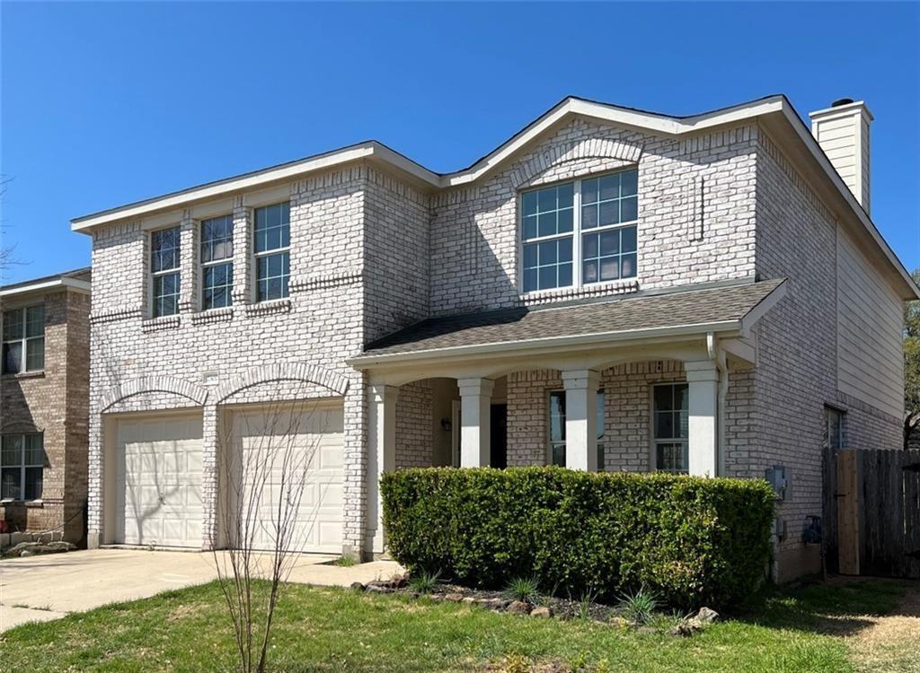 A classic brick exterior with a welcoming porch a
