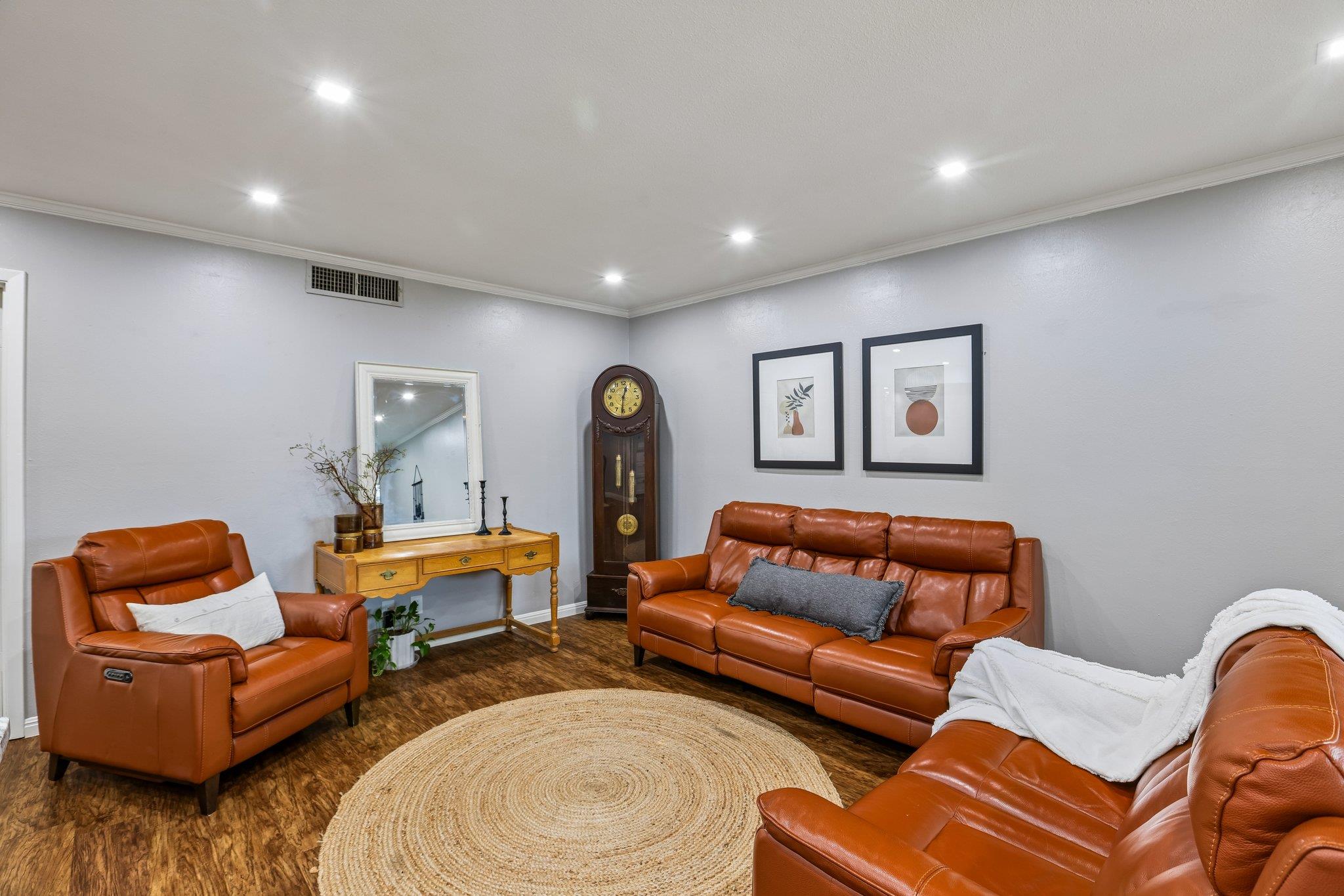 Recessed lighting illuminates this inviting livin