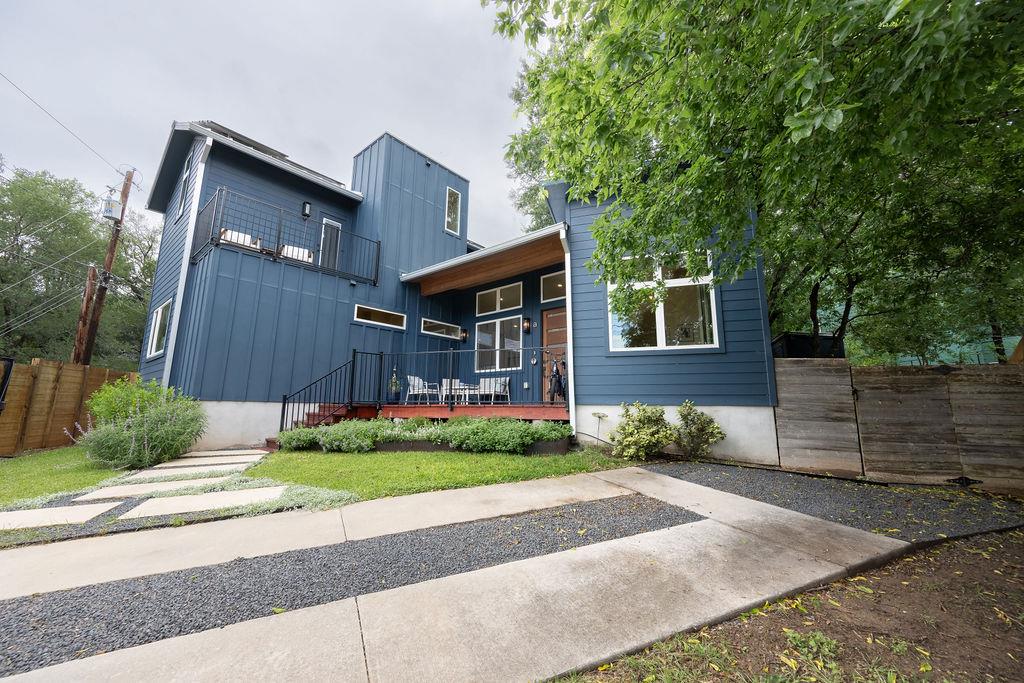 Modern blue siding and clean lines define this co