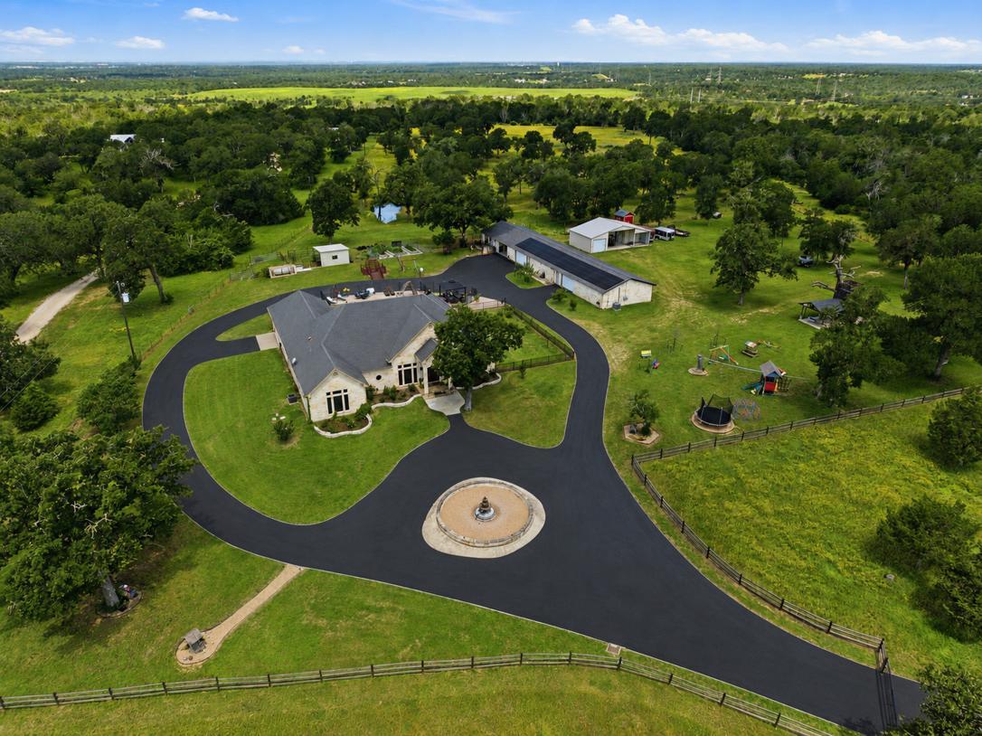 An expansive estate bordered by fencing features 