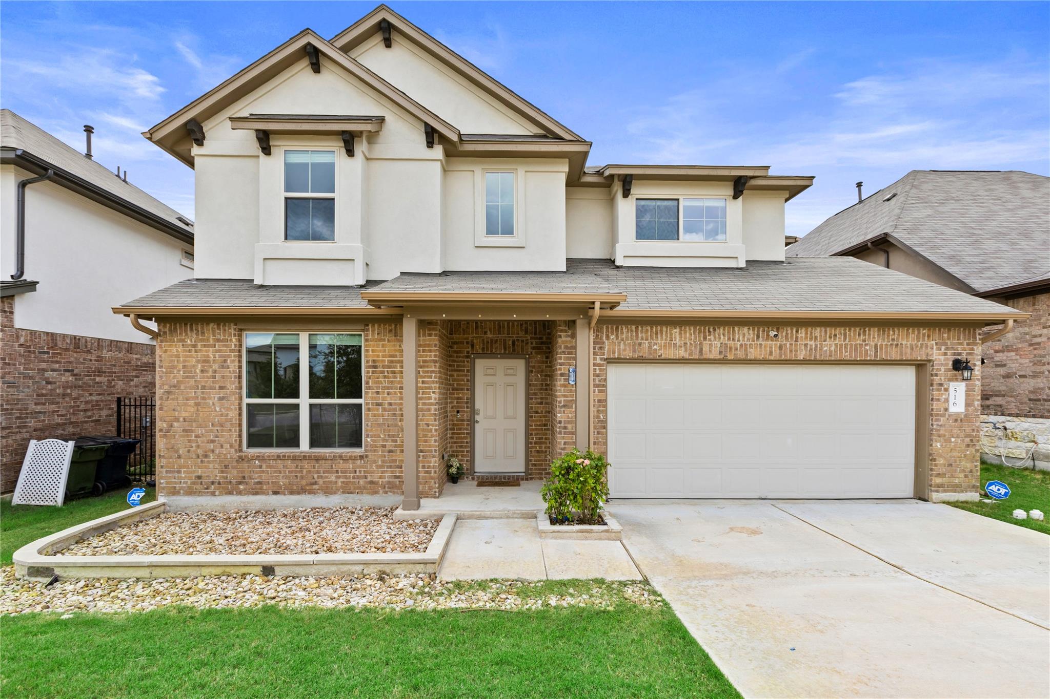 A welcoming facade with a mix of brick and stucco