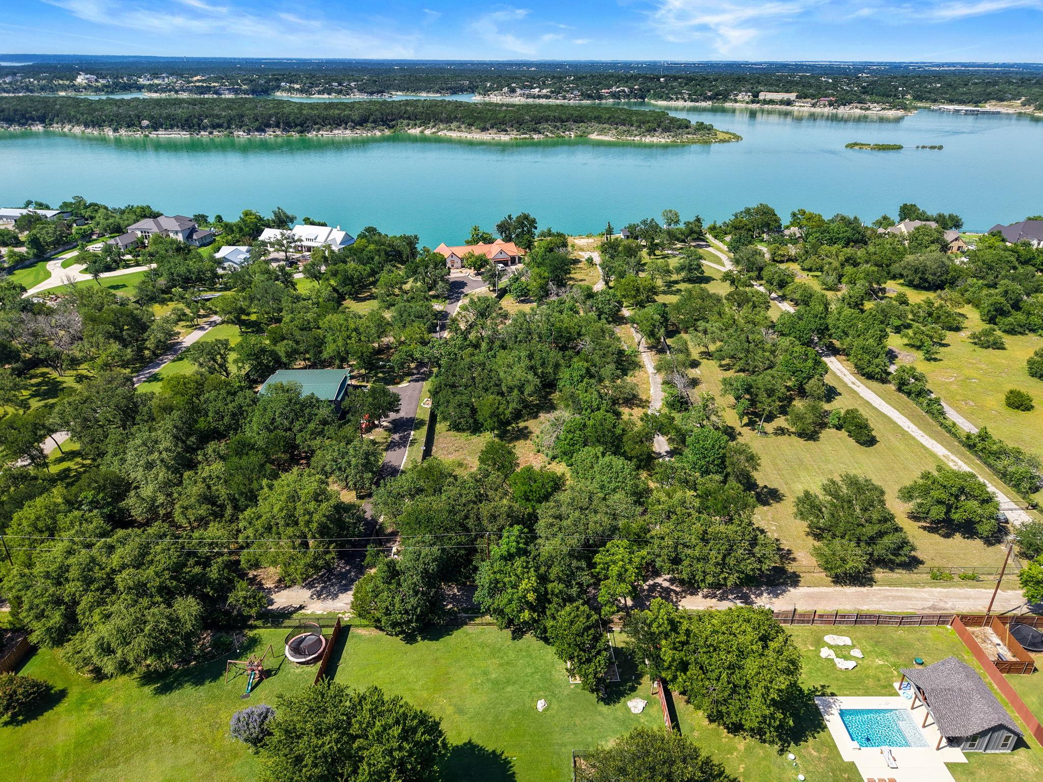 Perched above a tranquil lake, this expansive pro