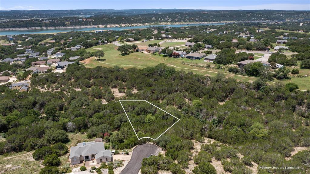 A spacious lot amidst lush trees, offering tranqu