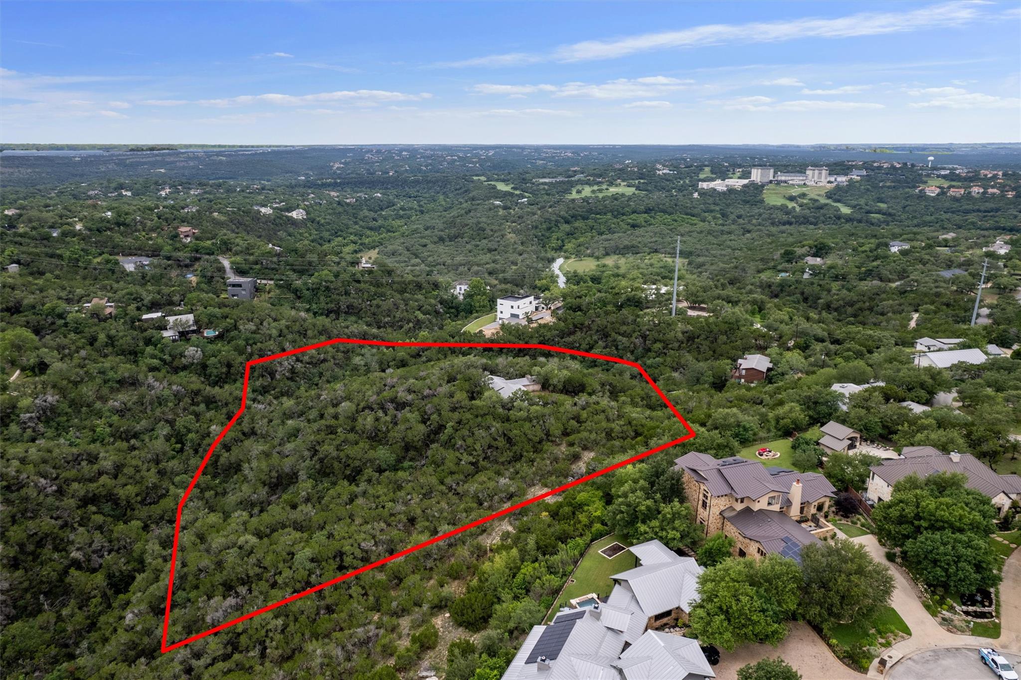 A tranquil, tree-filled lot provides a verdant ba