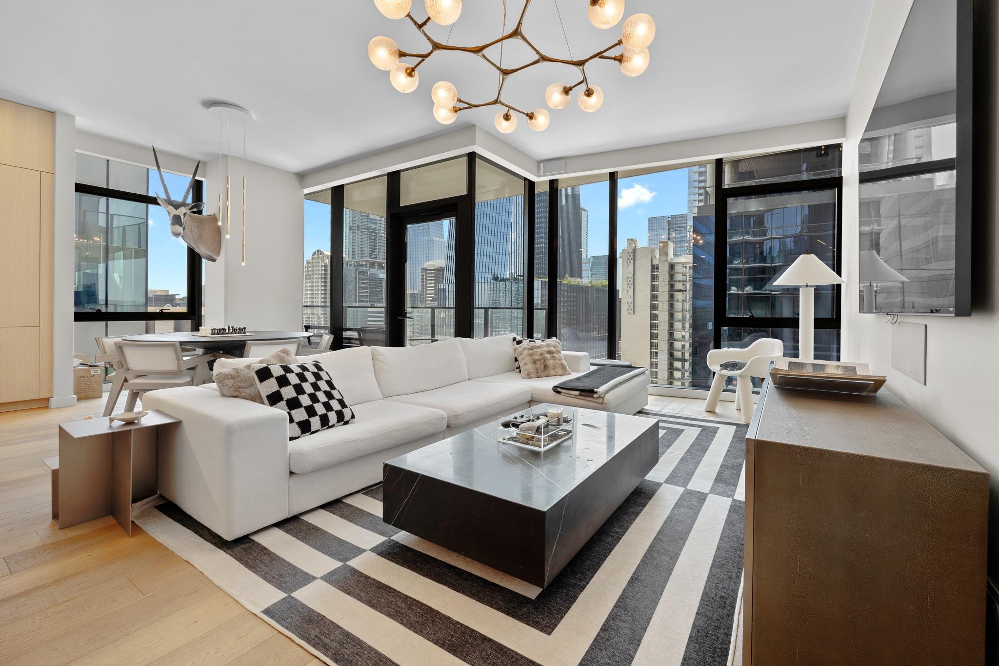 Floor-to-ceiling windows offer captivating city v