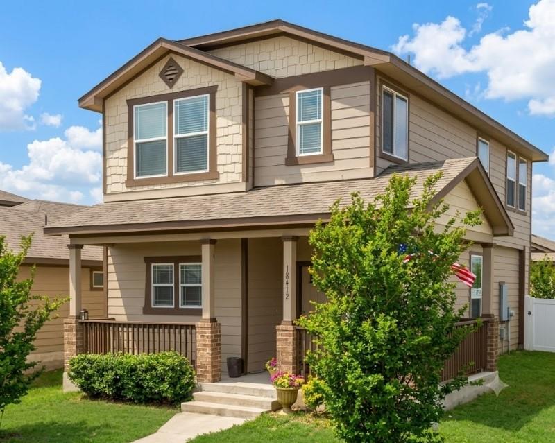 A charming two-story home with a welcoming front 