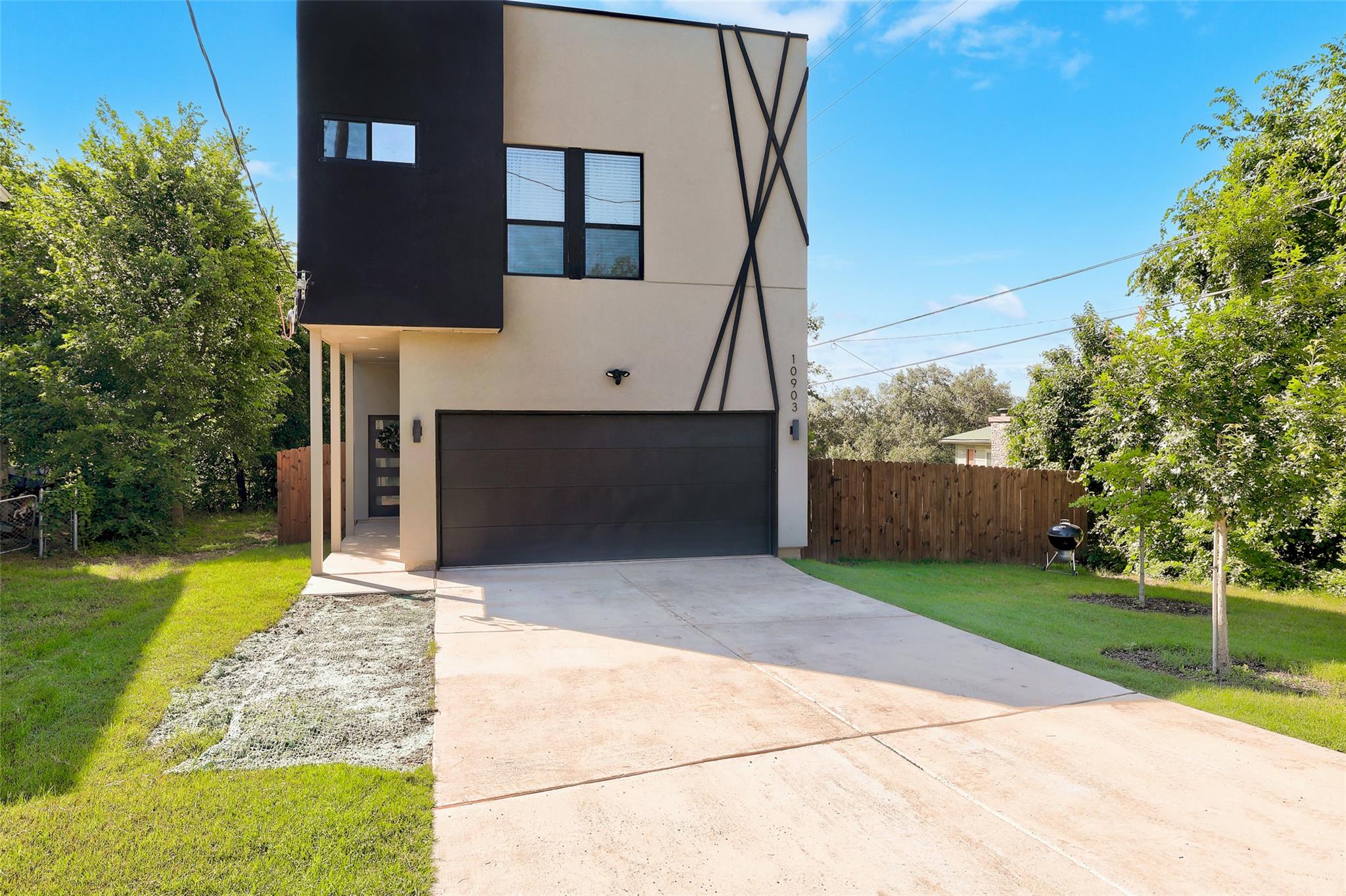 Modern facade with a sleek garage door and concre