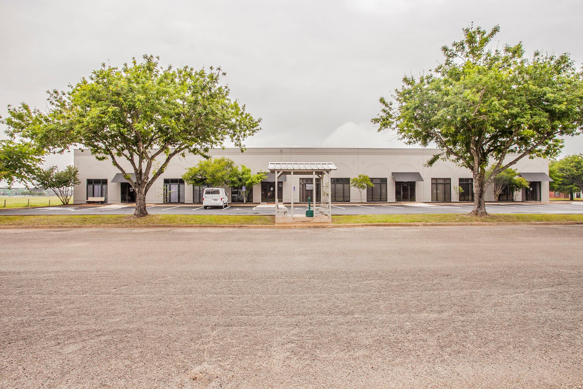 A commercial structure features multiple entrance