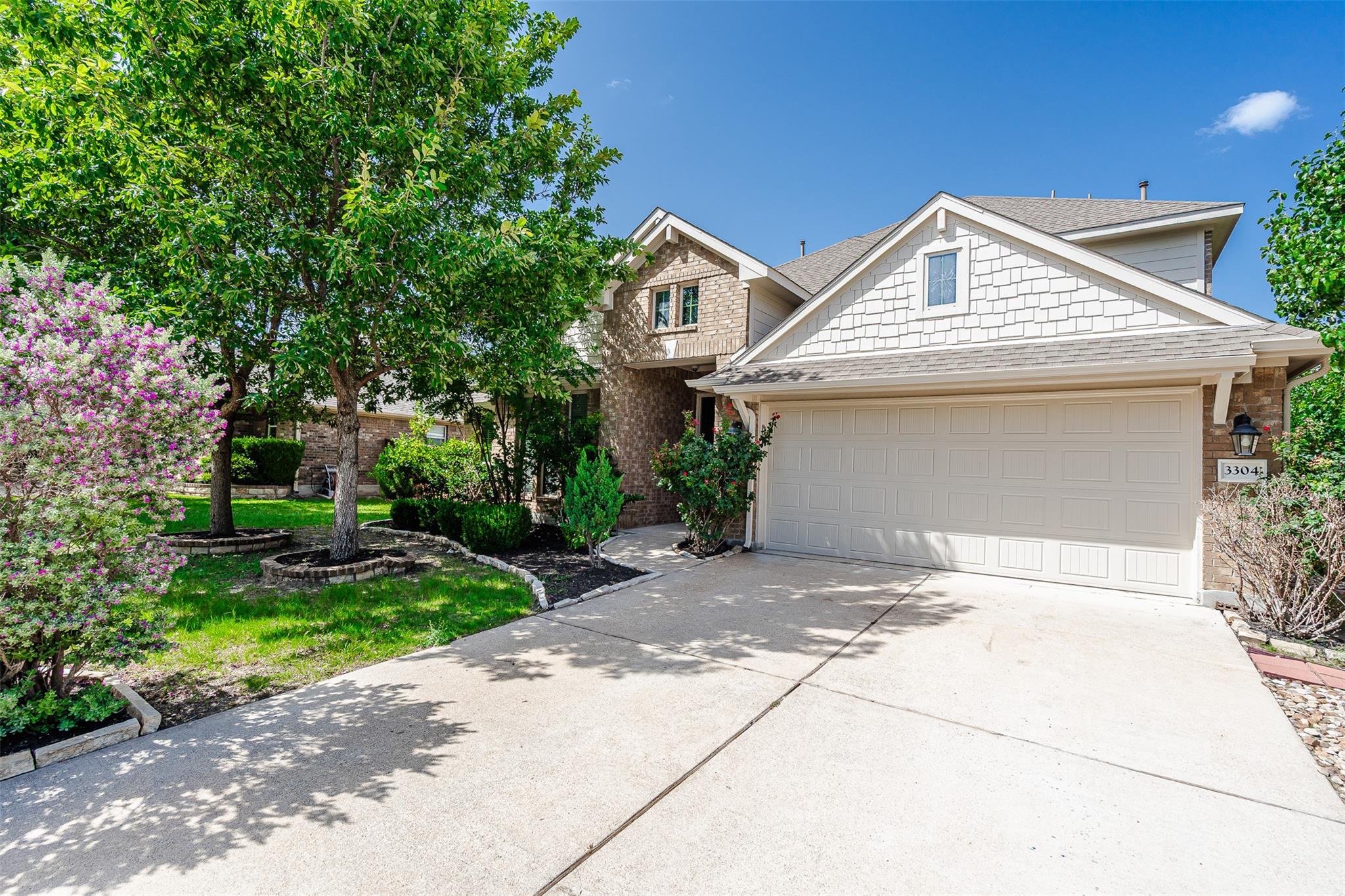 A welcoming front exterior showcasing a tidy land