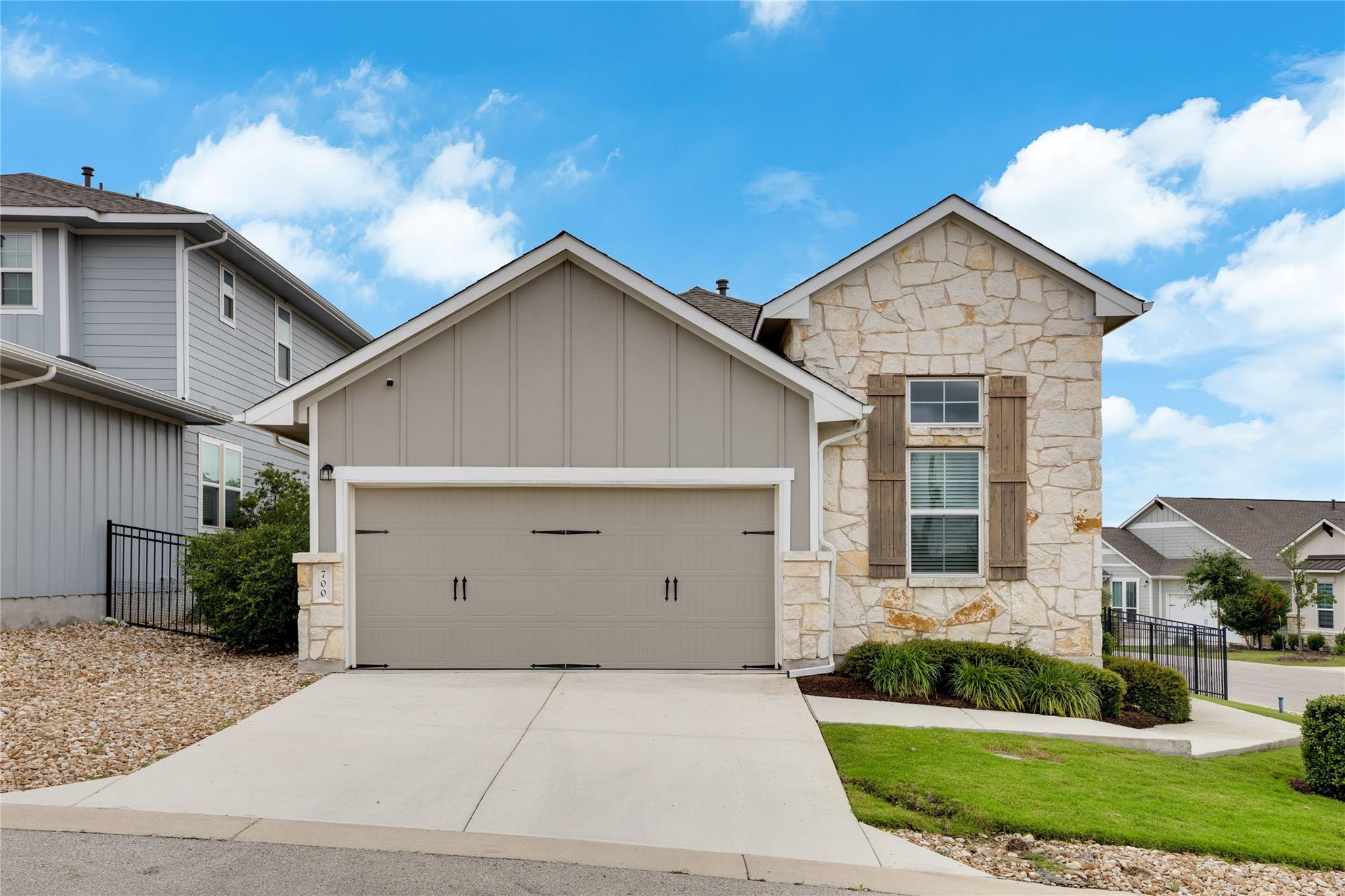 A welcoming facade showcases a combination of sto