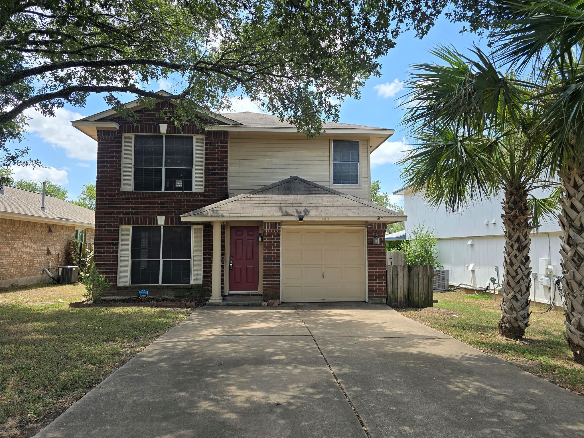 A well-maintained two-story residence with a conc