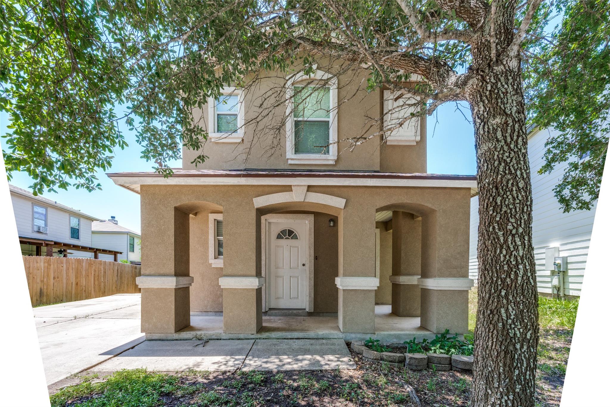 A charming two-story facade with arched entryways
