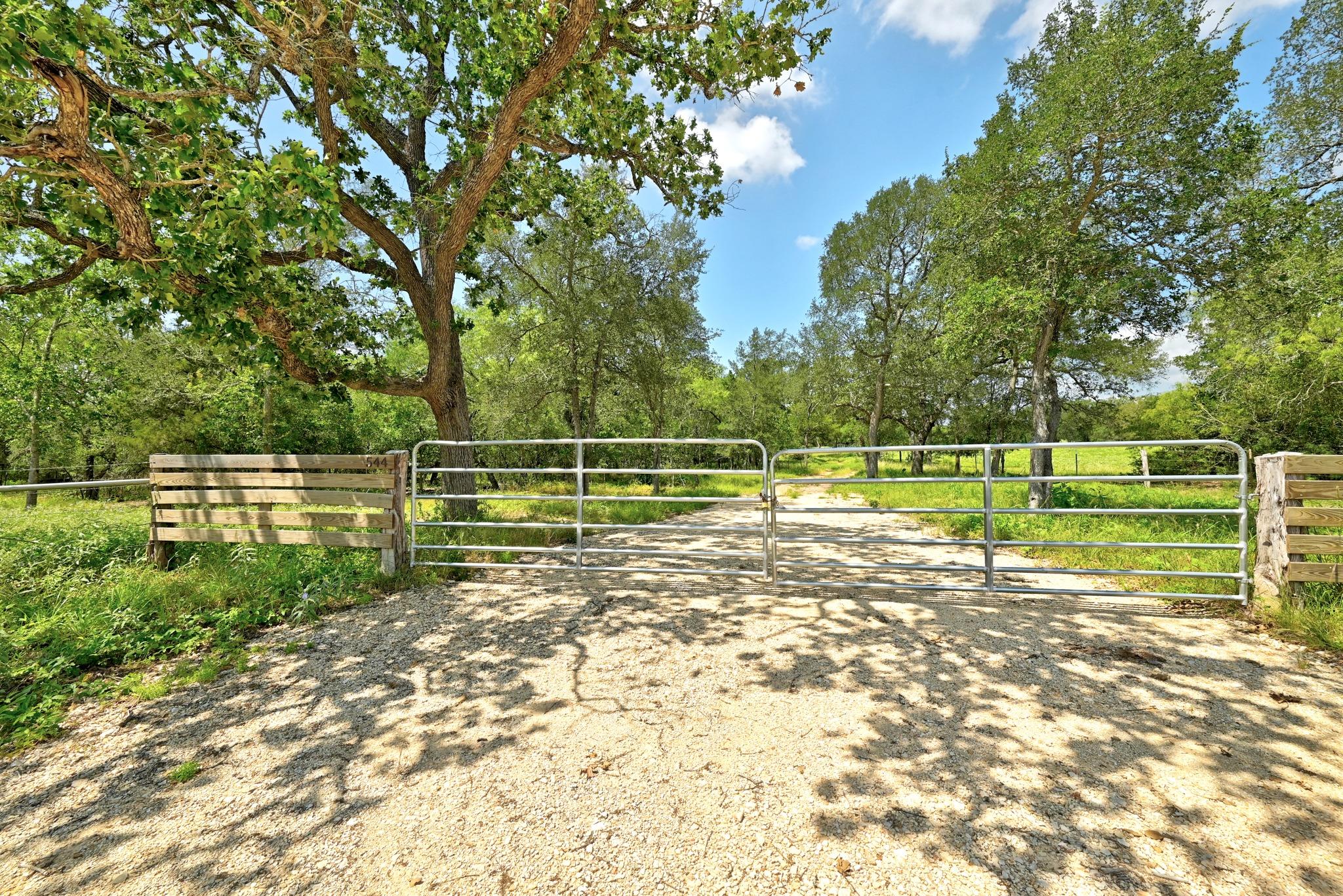 Secure gated entry welcomes you to this verdant, 