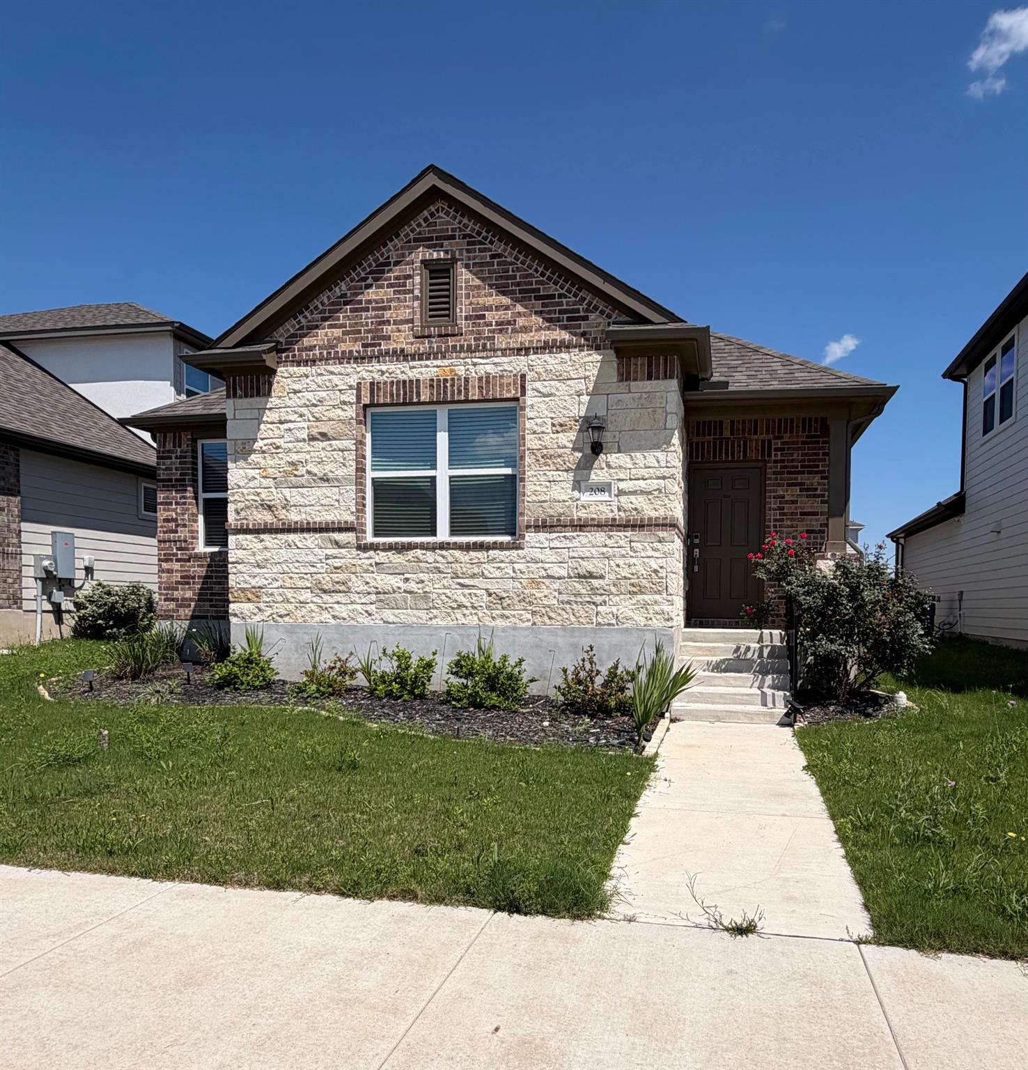 Discover charming curb appeal with brick and ston