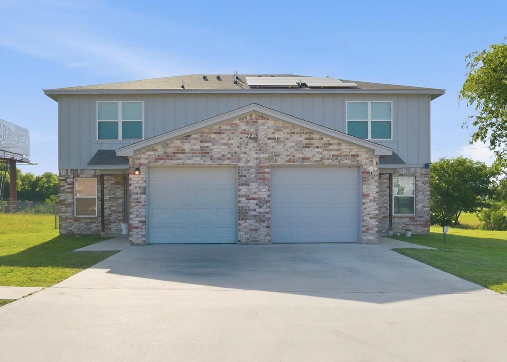 A duplex with attached garages offers practical l
