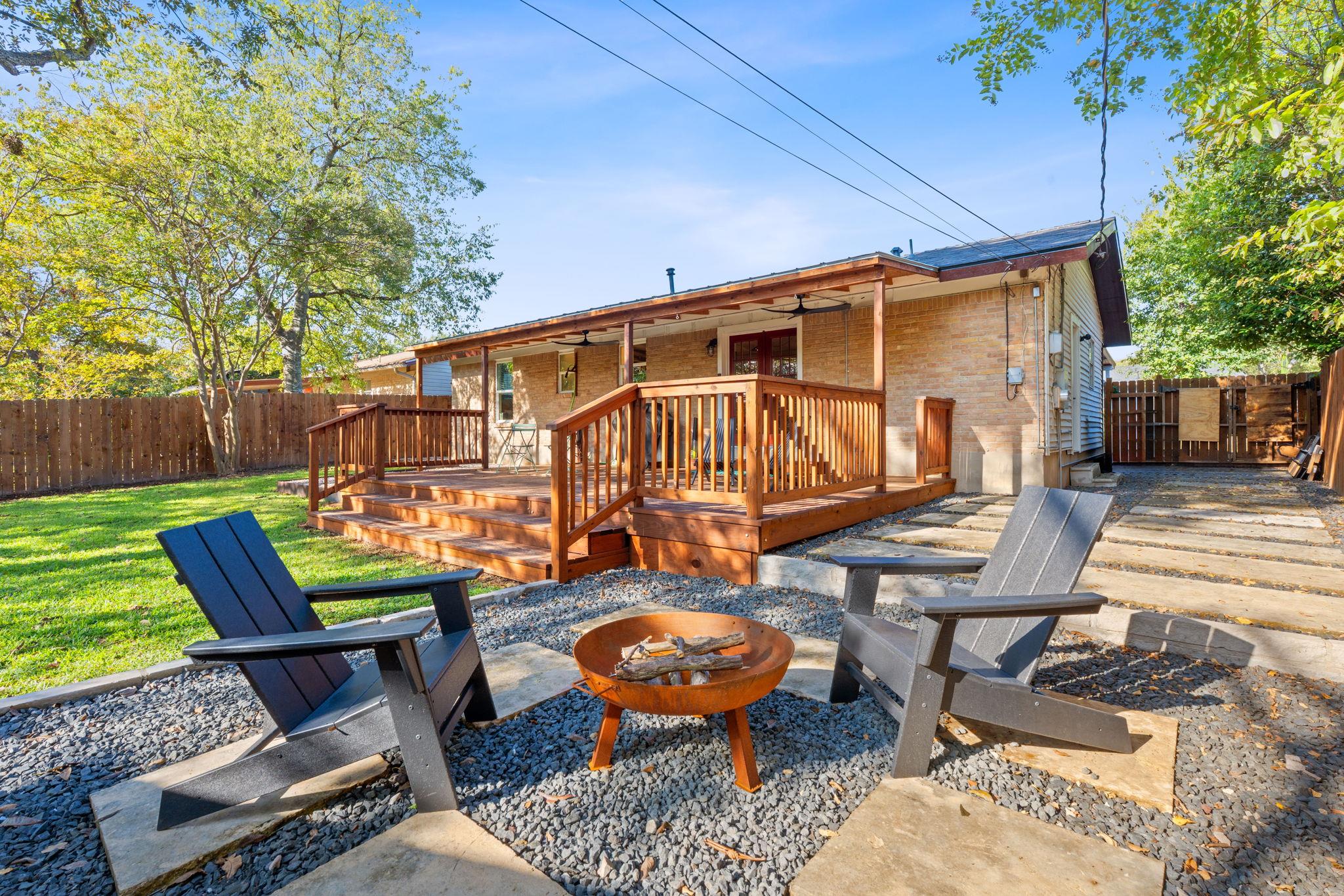 An inviting backyard oasis offers a spacious wood