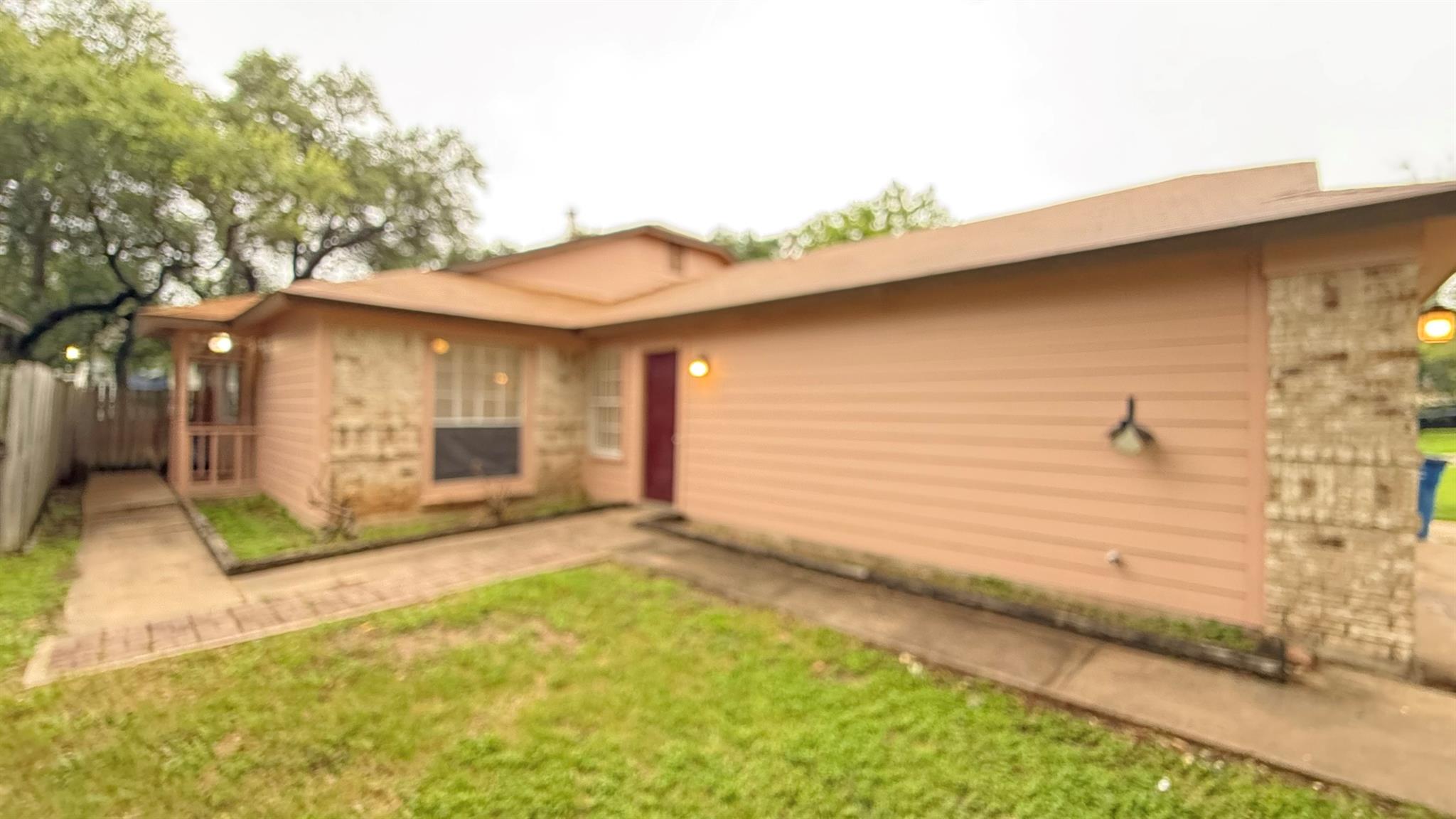 A welcoming facade featuring mixed siding and mat