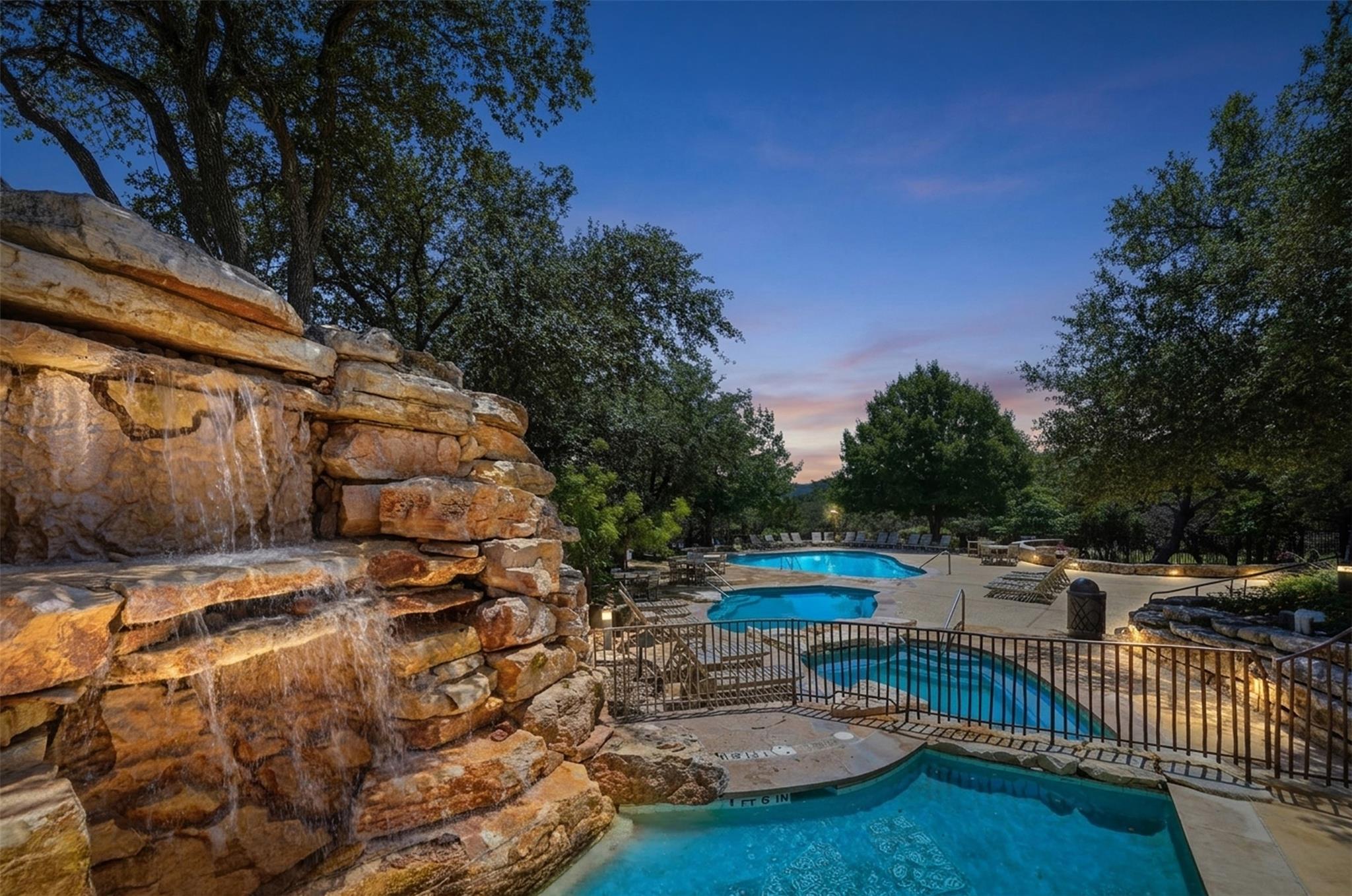 A tiered swimming pool and spa complex, featuring