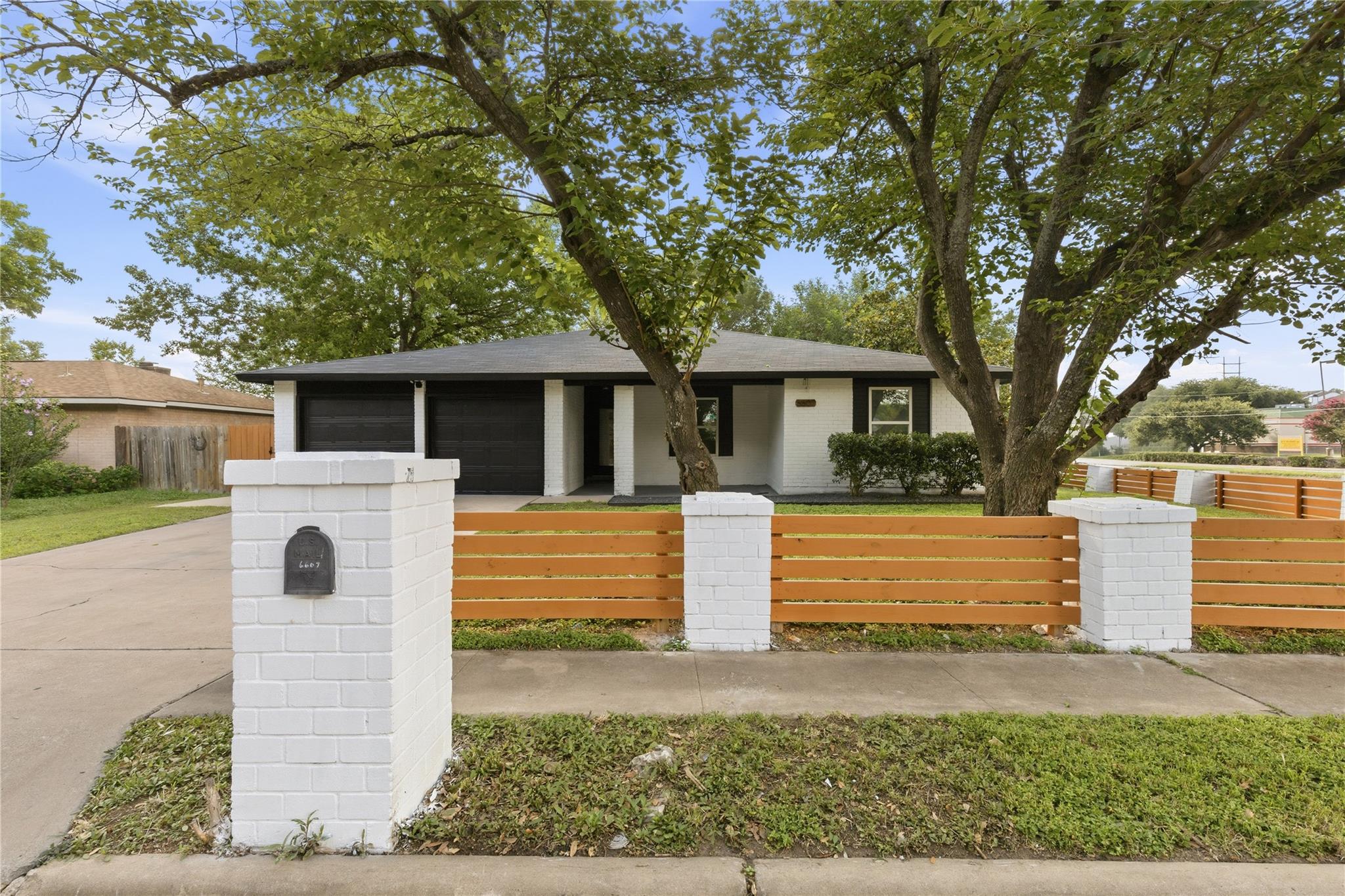 A striking modern home with a contrasting black a