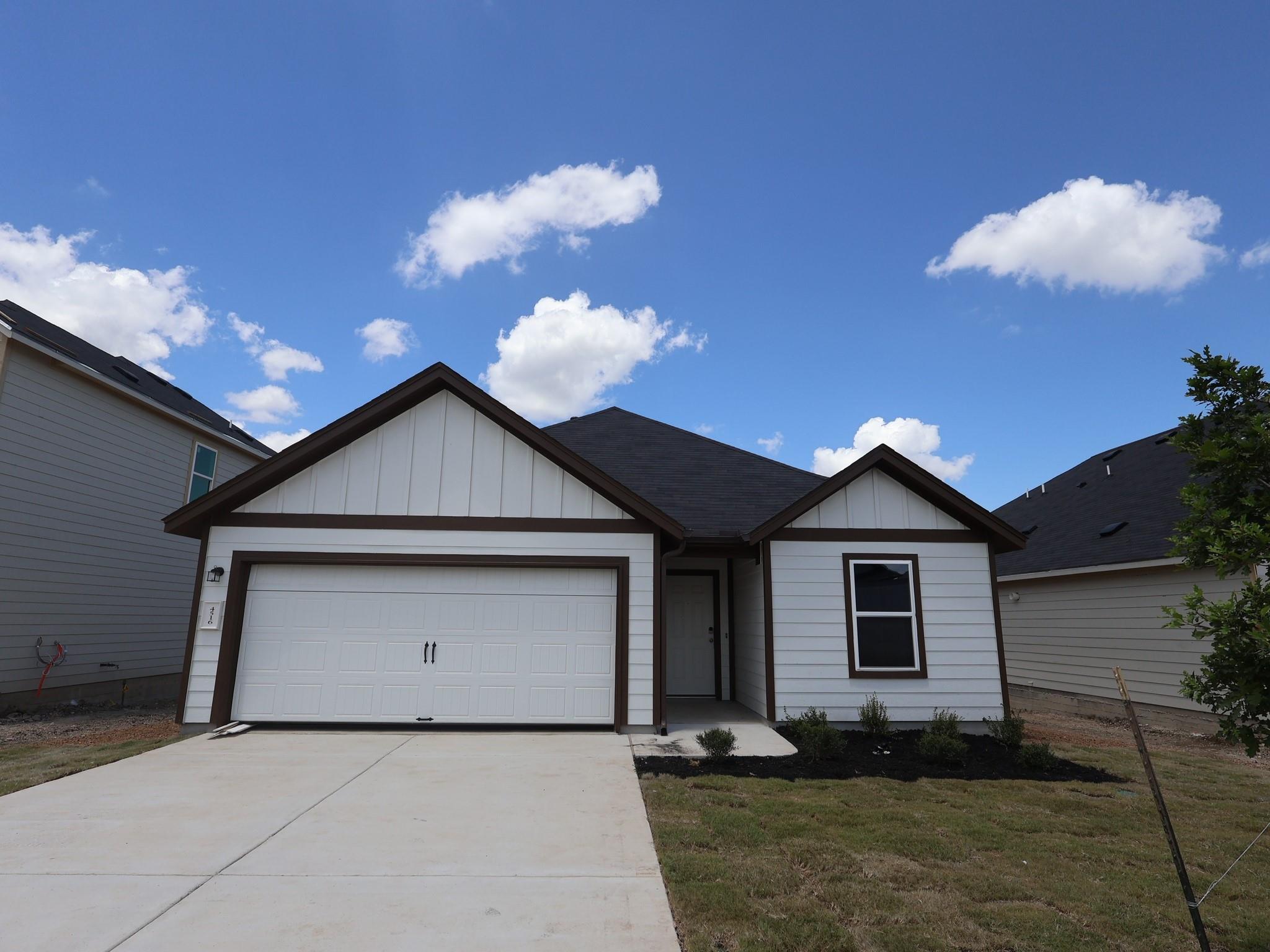A well-maintained single-story home with an attac