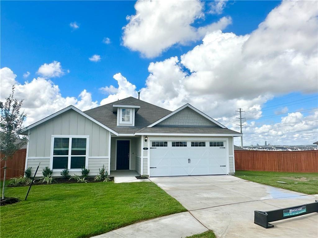 A welcoming front exterior offers a paved drivewa