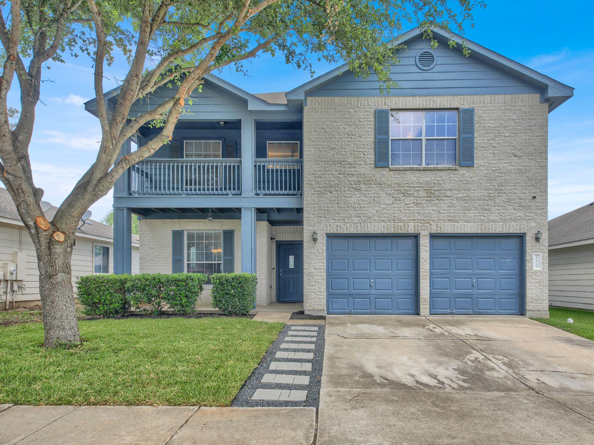 Two-story home presents a welcoming facade with a