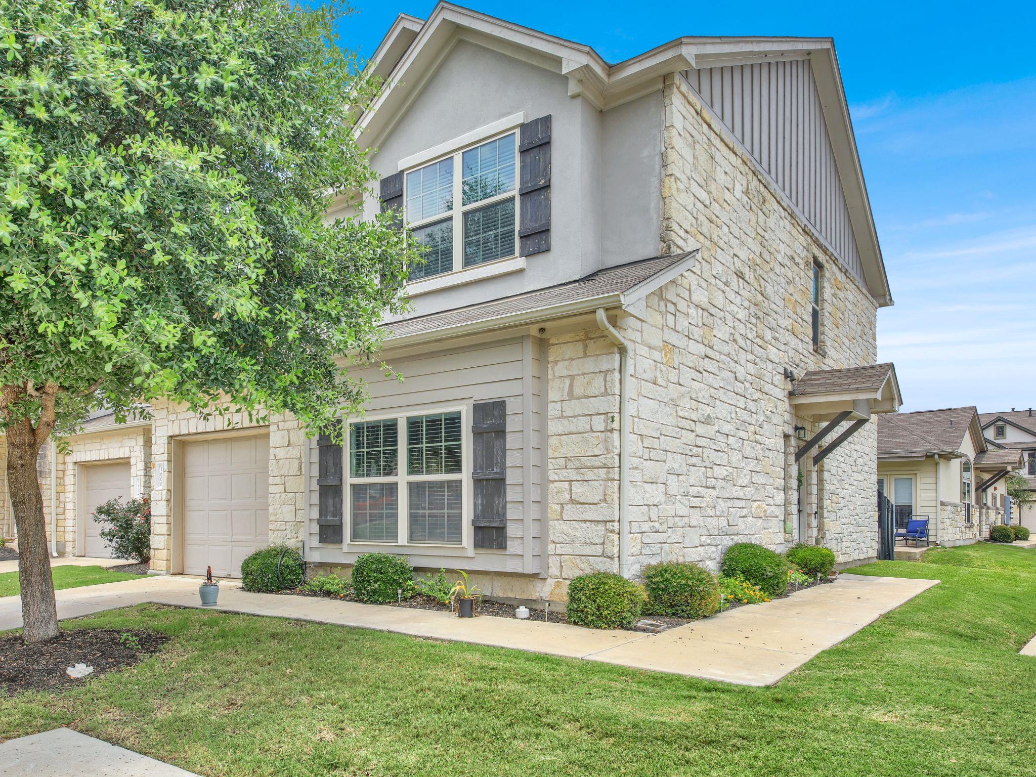 A striking exterior combines stone and siding wit