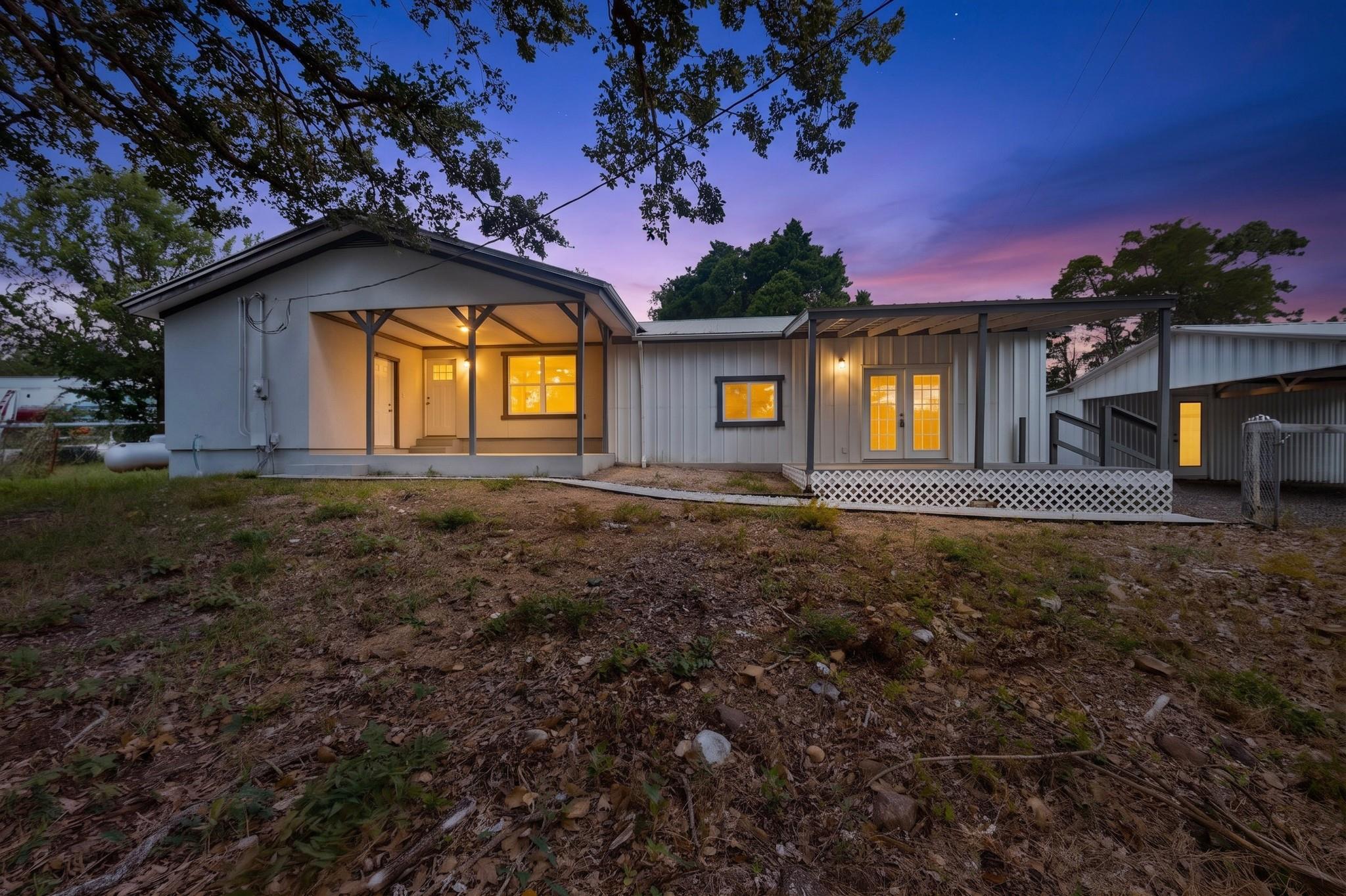 A welcoming front porch invites relaxation at thi