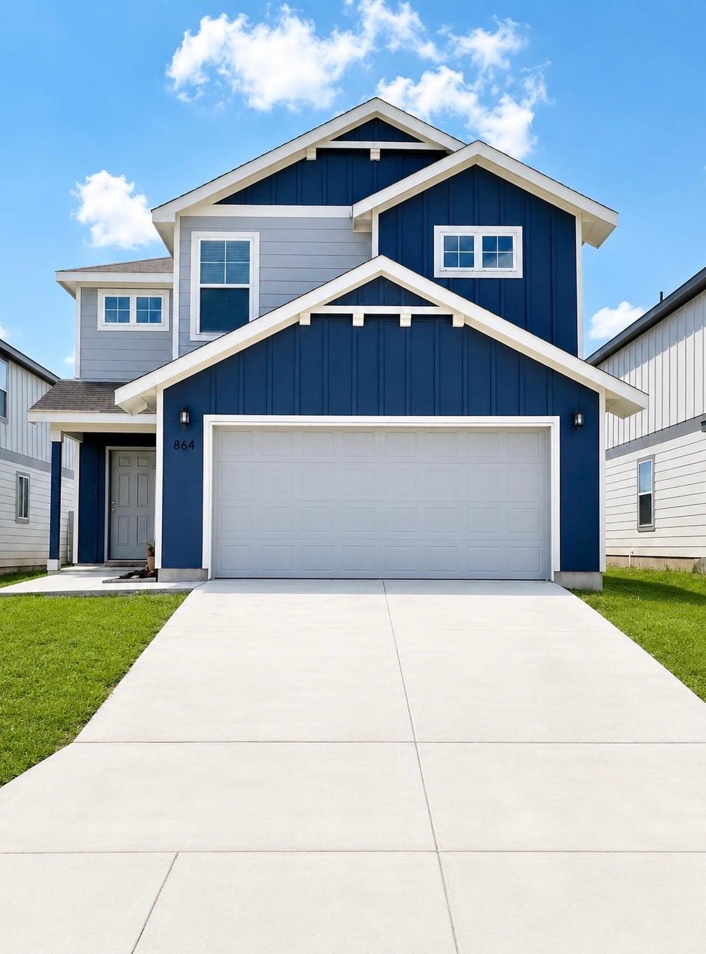 Modern home with eye-catching blue and gray sidin