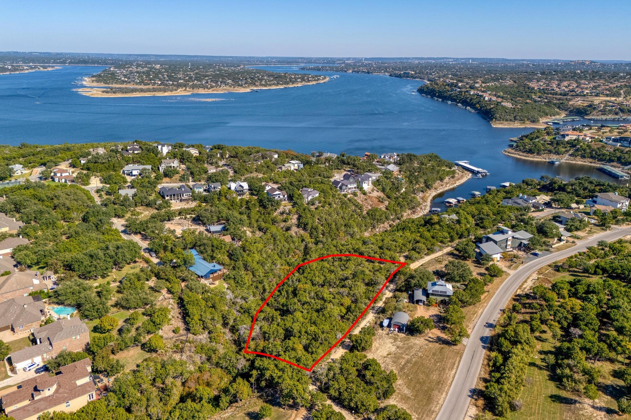 Secure this verdant lake-view parcel, primed for 