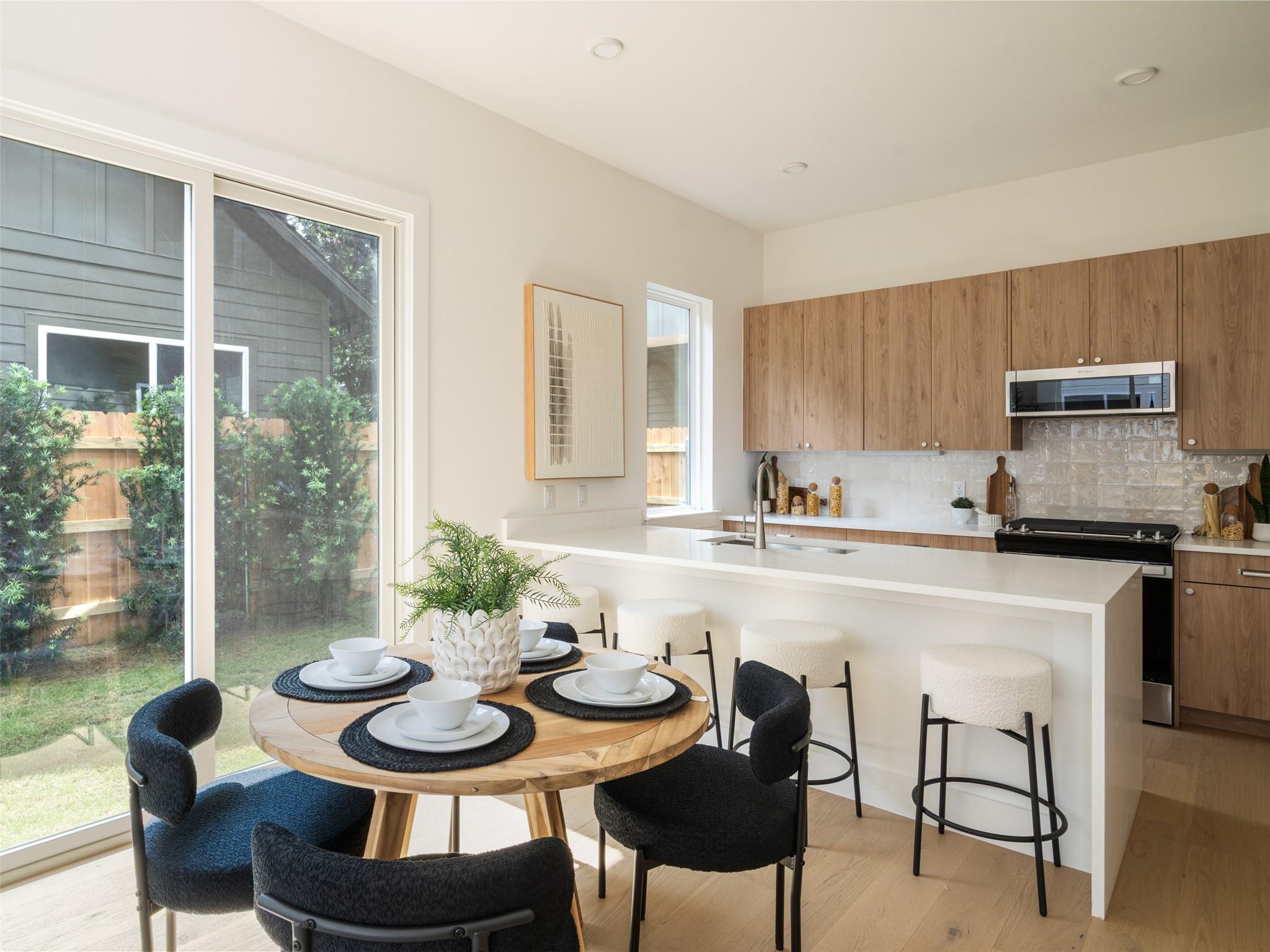Modern kitchen featuring wood-finish cabinetry, a
