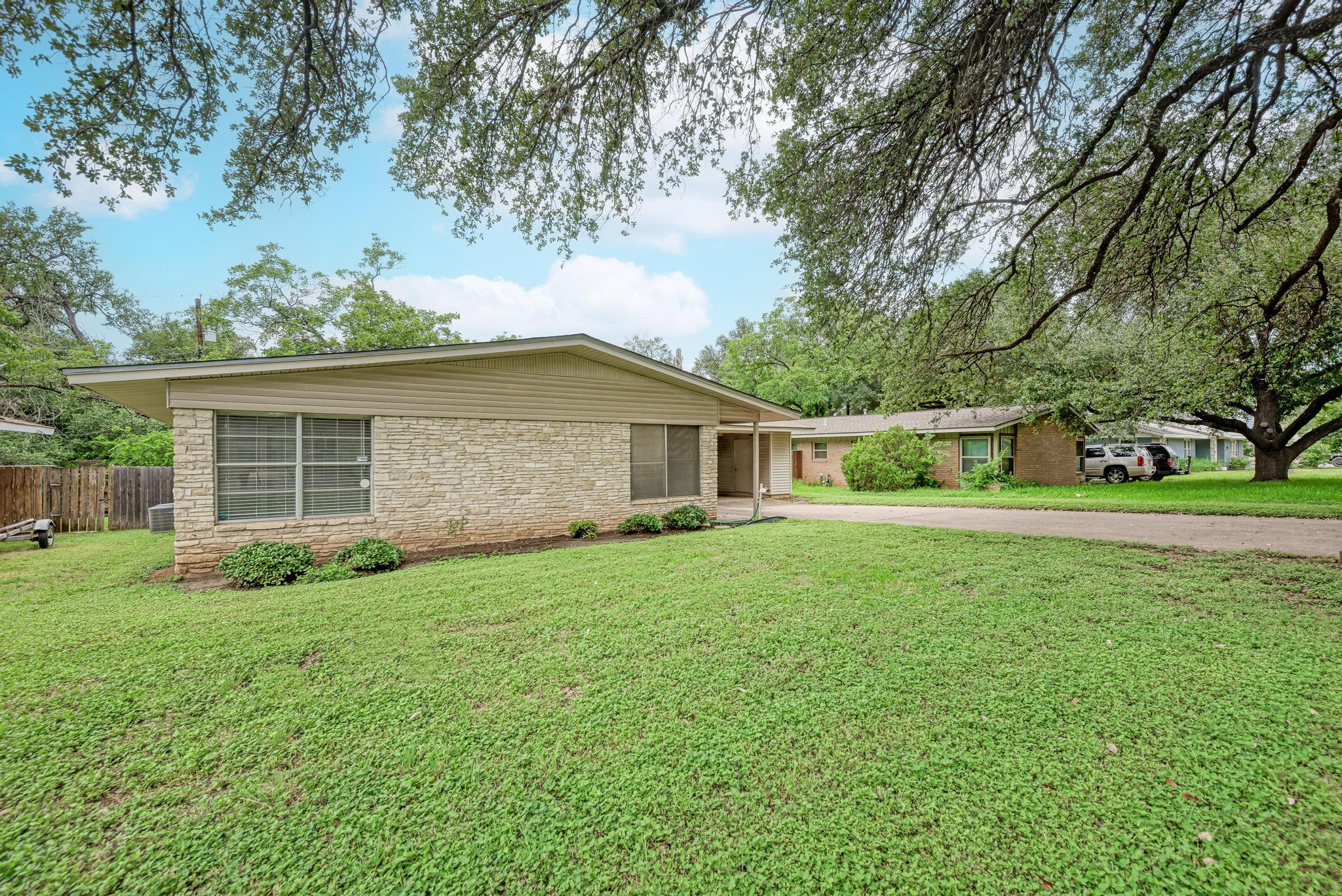 A classic mid-century home boasts a durable stone