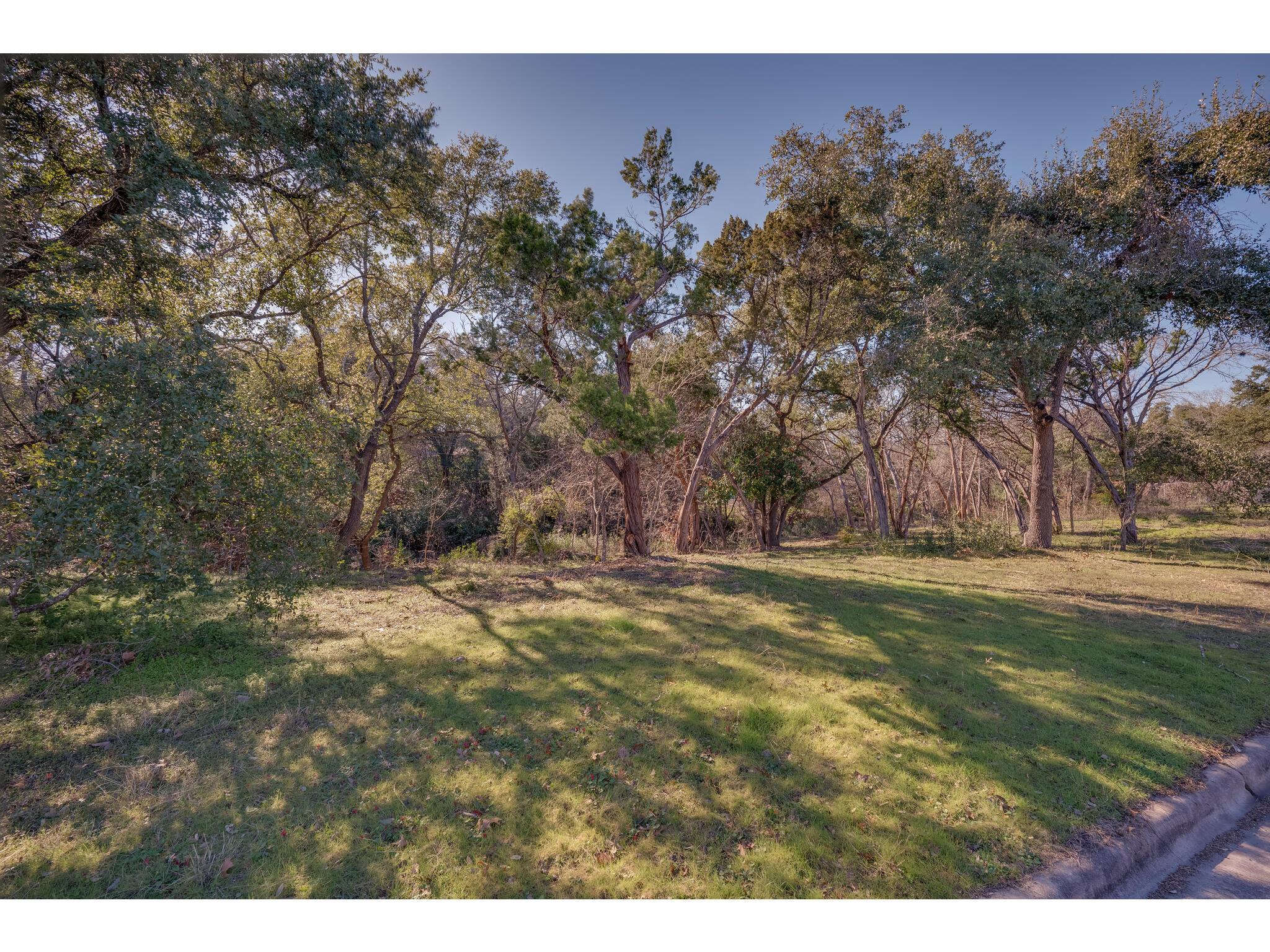 A tranquil, tree-lined setting offers a private y