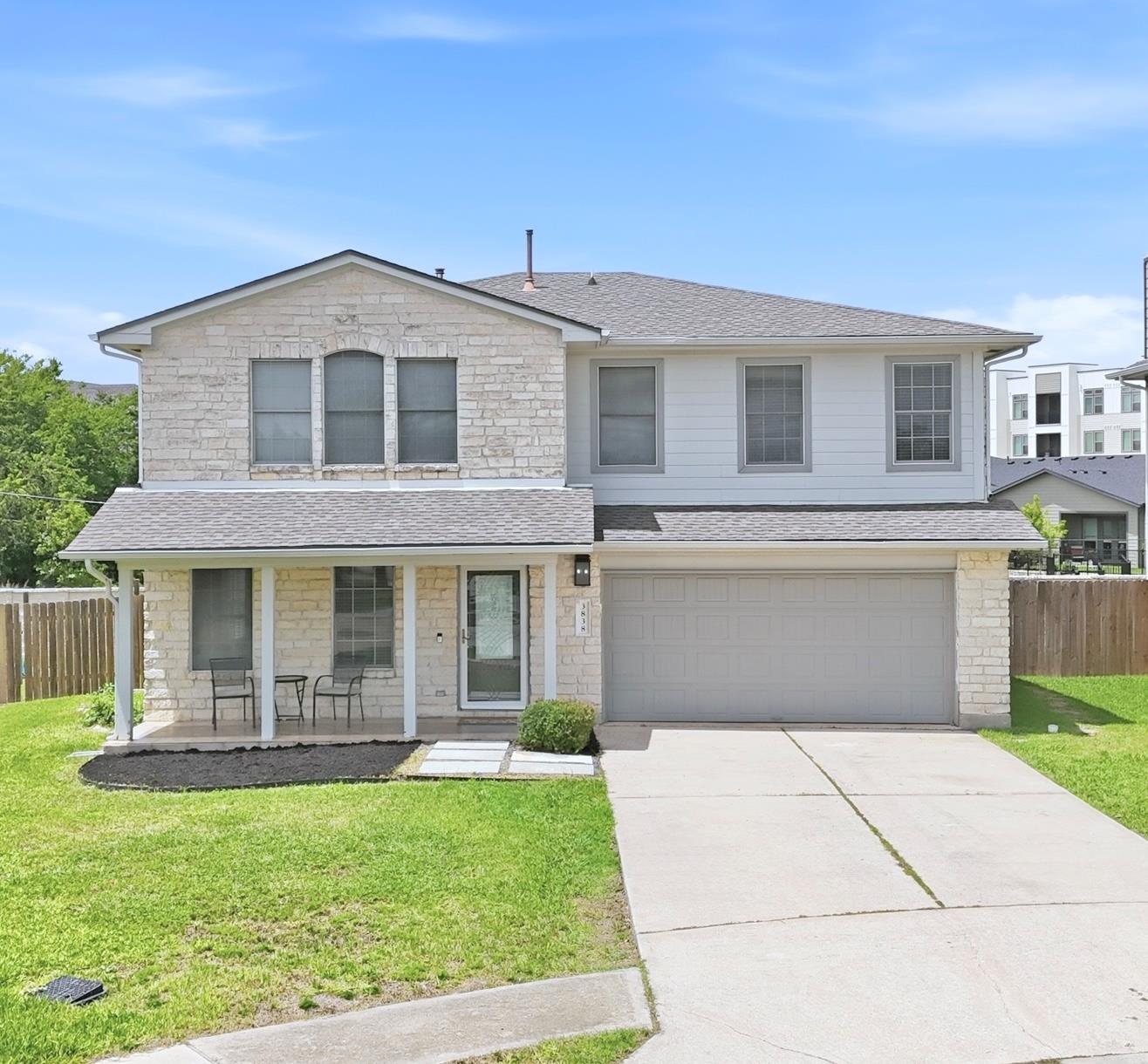 A charming two-story home with a welcoming front 
