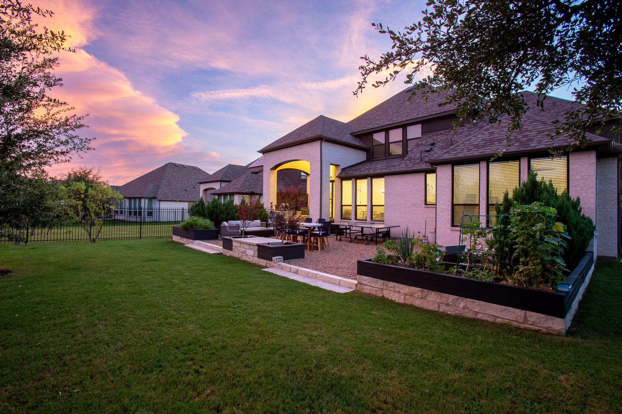 Sunset views over a meticulously landscaped yard 